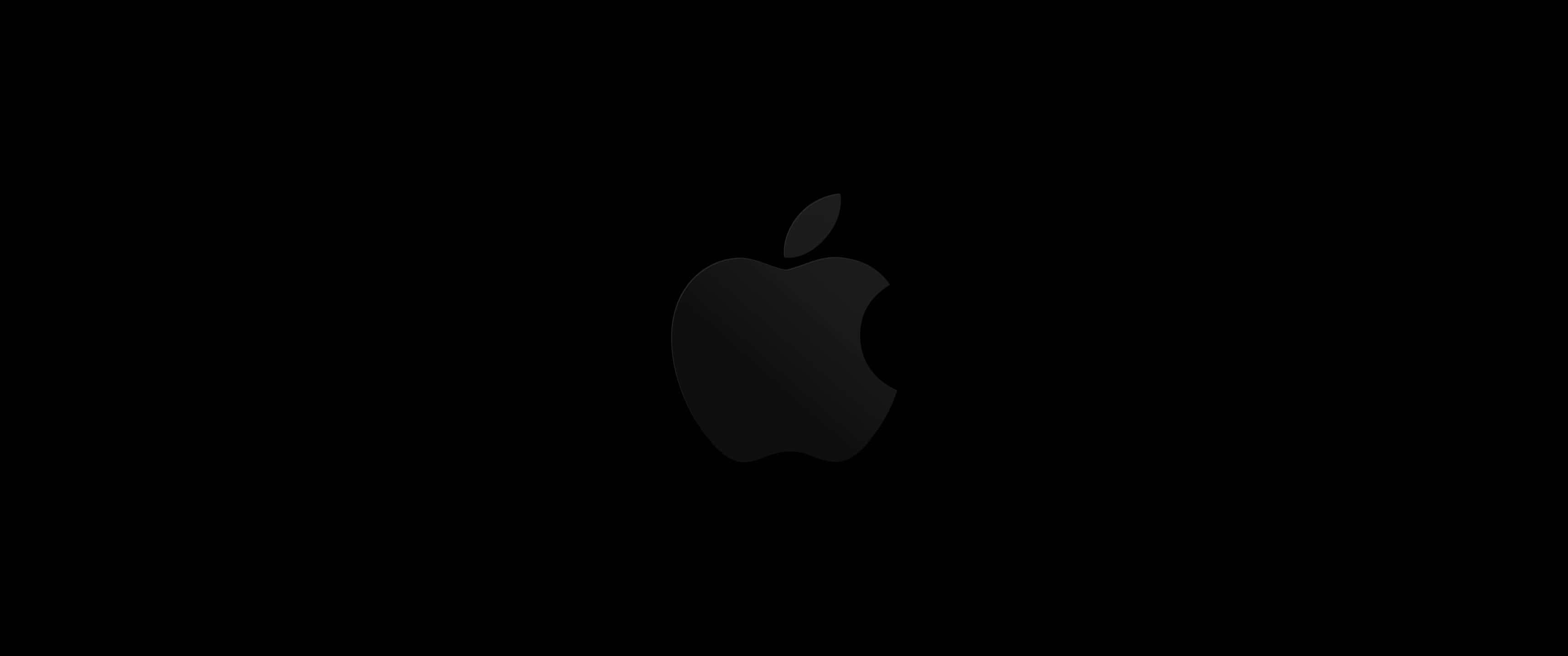 Minimalist Monochrome 桌布 壁紙 — 一個極簡黑色Apple標誌，居中放置在帶有微妙漸變陰影的純黑色背景上。