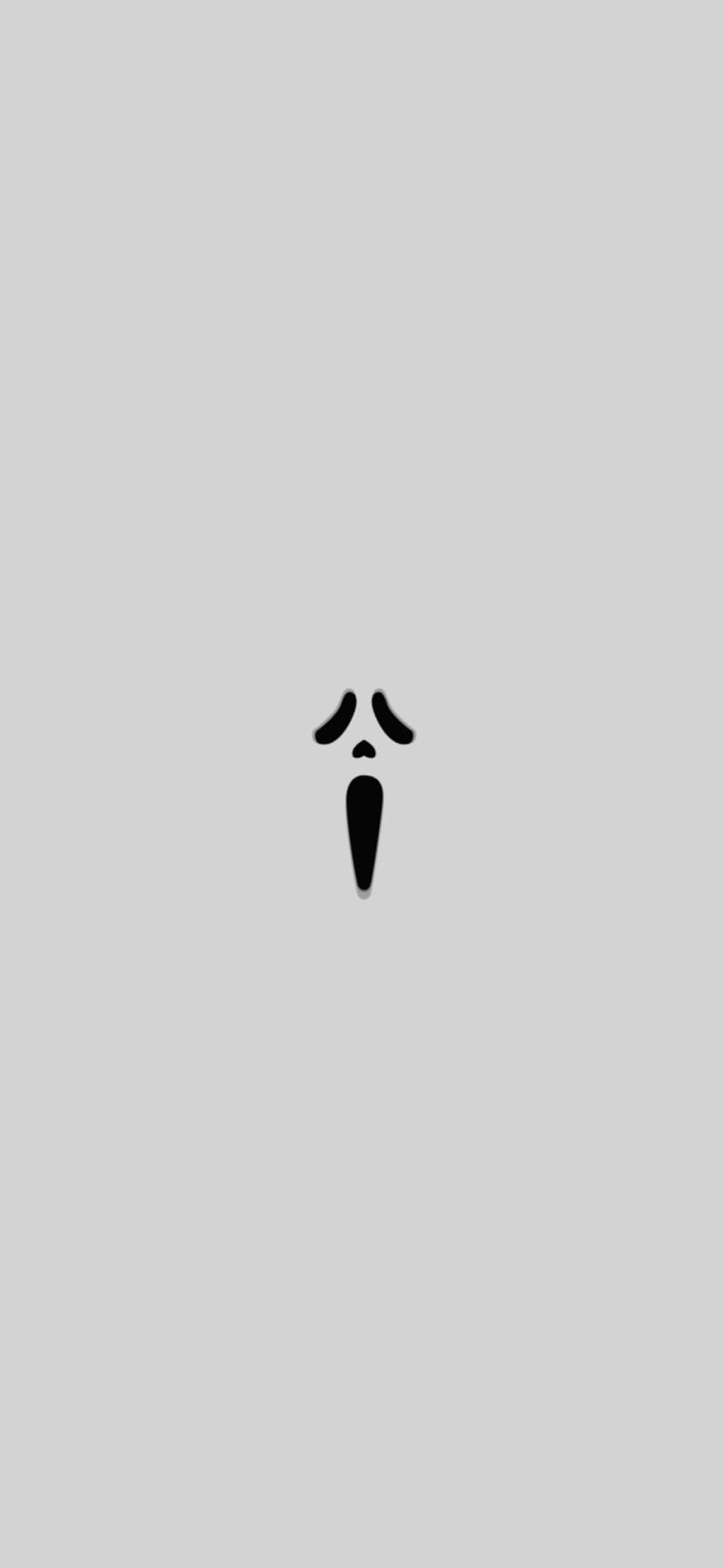 Cute White 桌布 壁紙 — 一個極簡黑色鬼魂圖示，居中放在純淺灰色背景上。