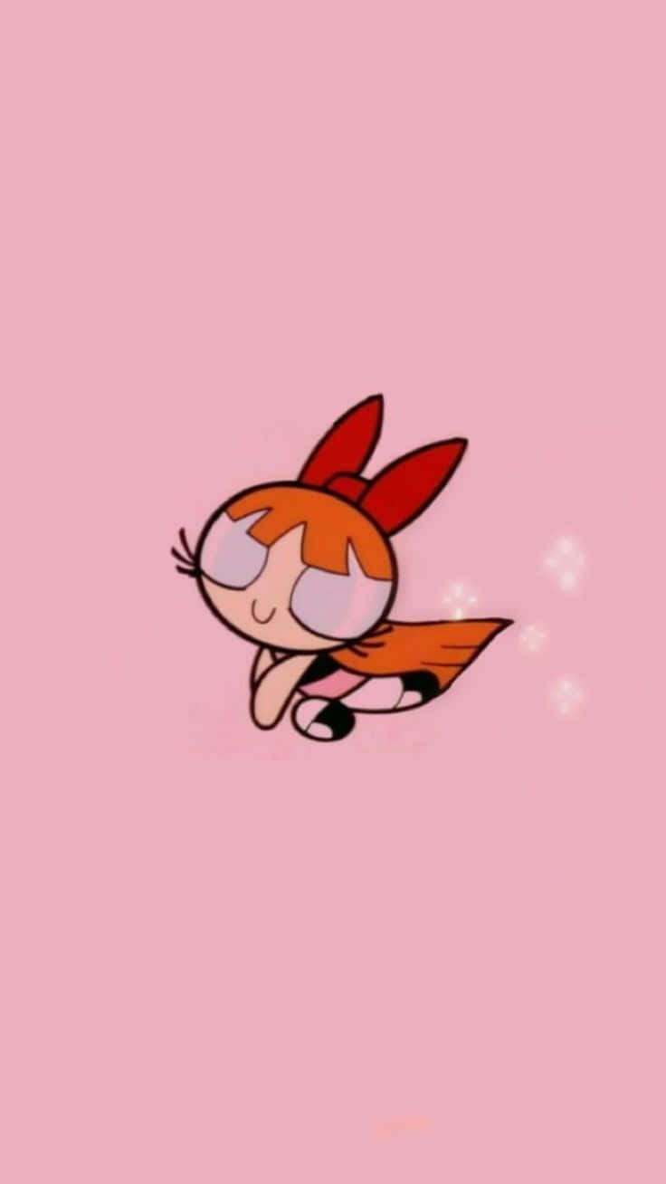Powerpuff Girls Aesthetic 桌布 壁紙 — 一個橙色頭髮、戴紅色蝴蝶結的卡通角色，在帶有閃粉的柔和粉紅色背景上輕輕漂浮。