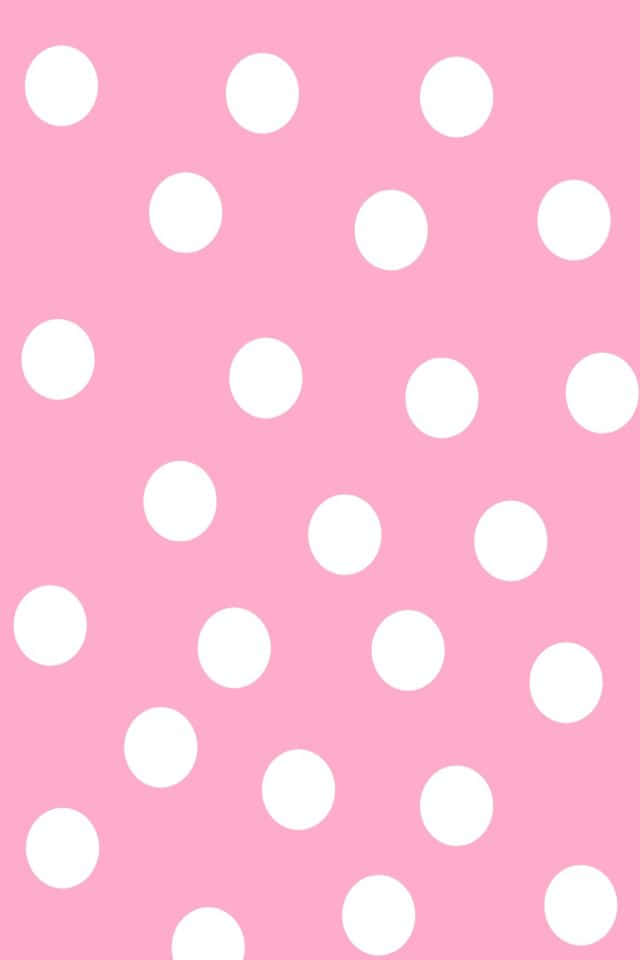 Pink Polka Dot 桌布 壁紙 — 一個歡快的粉紅色背景，裝飾著均勻分佈的白色圓點，呈現簡潔極簡的圖案。