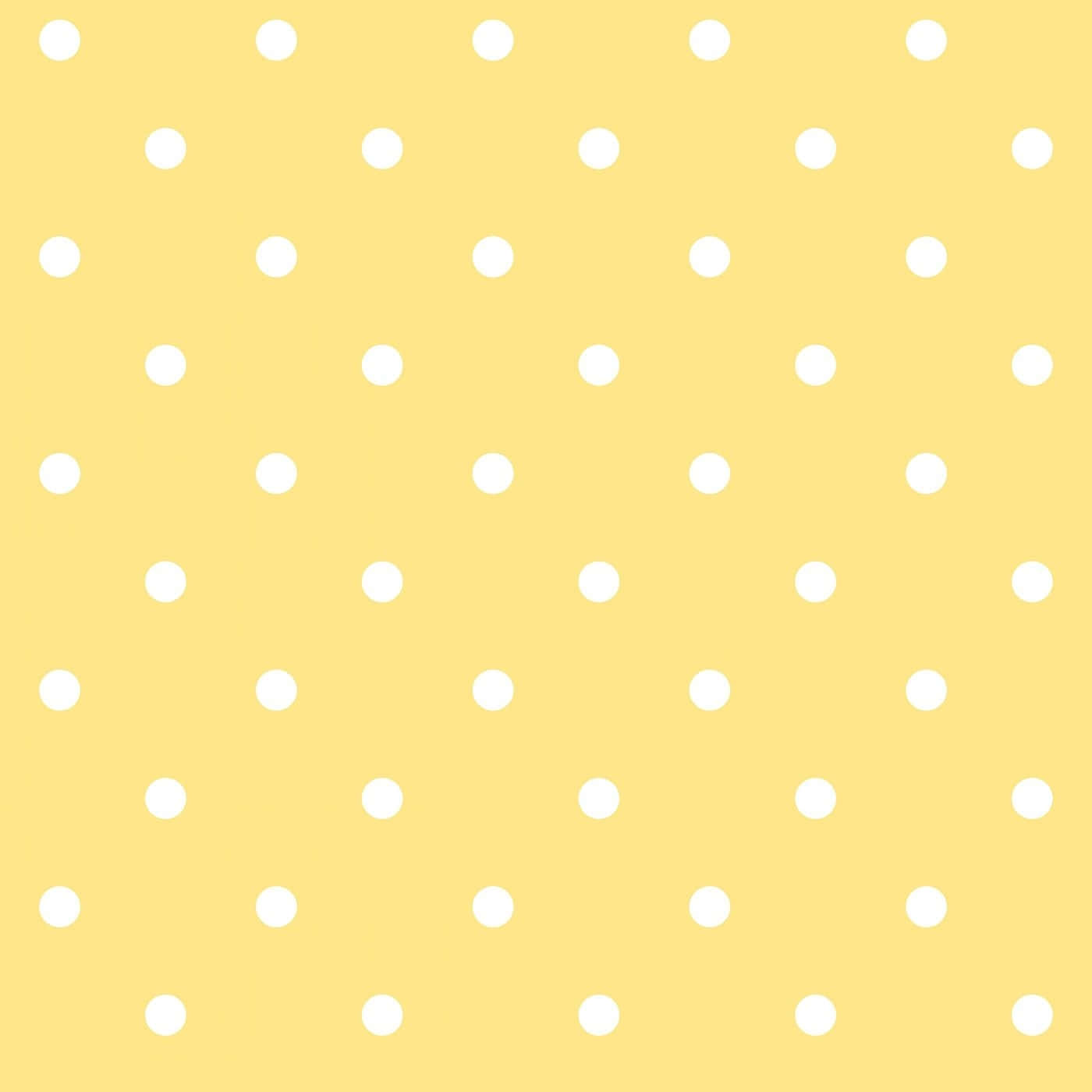 Yellow Polka Dot 桌布 壁紙 — 一個歡快的黃色背景，裝飾著均勻分佈的白色圓點，形成重複圖案。