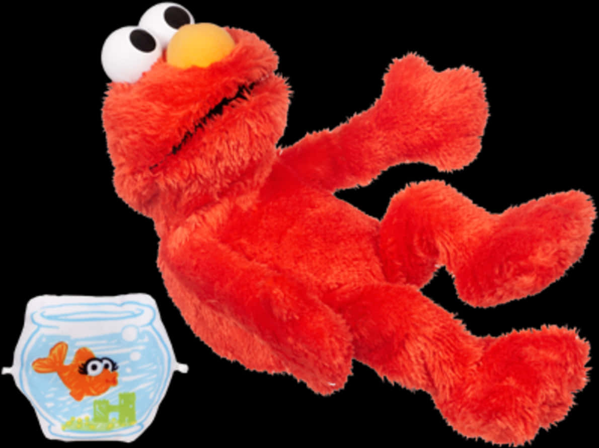 Elmo 桌布 壁紙 — 一個毛茸茸的紅色 Elmo 毛絨玩具躺在一個小魚缸旁邊，魚缸內有一條橙色魚，背景為黑色。