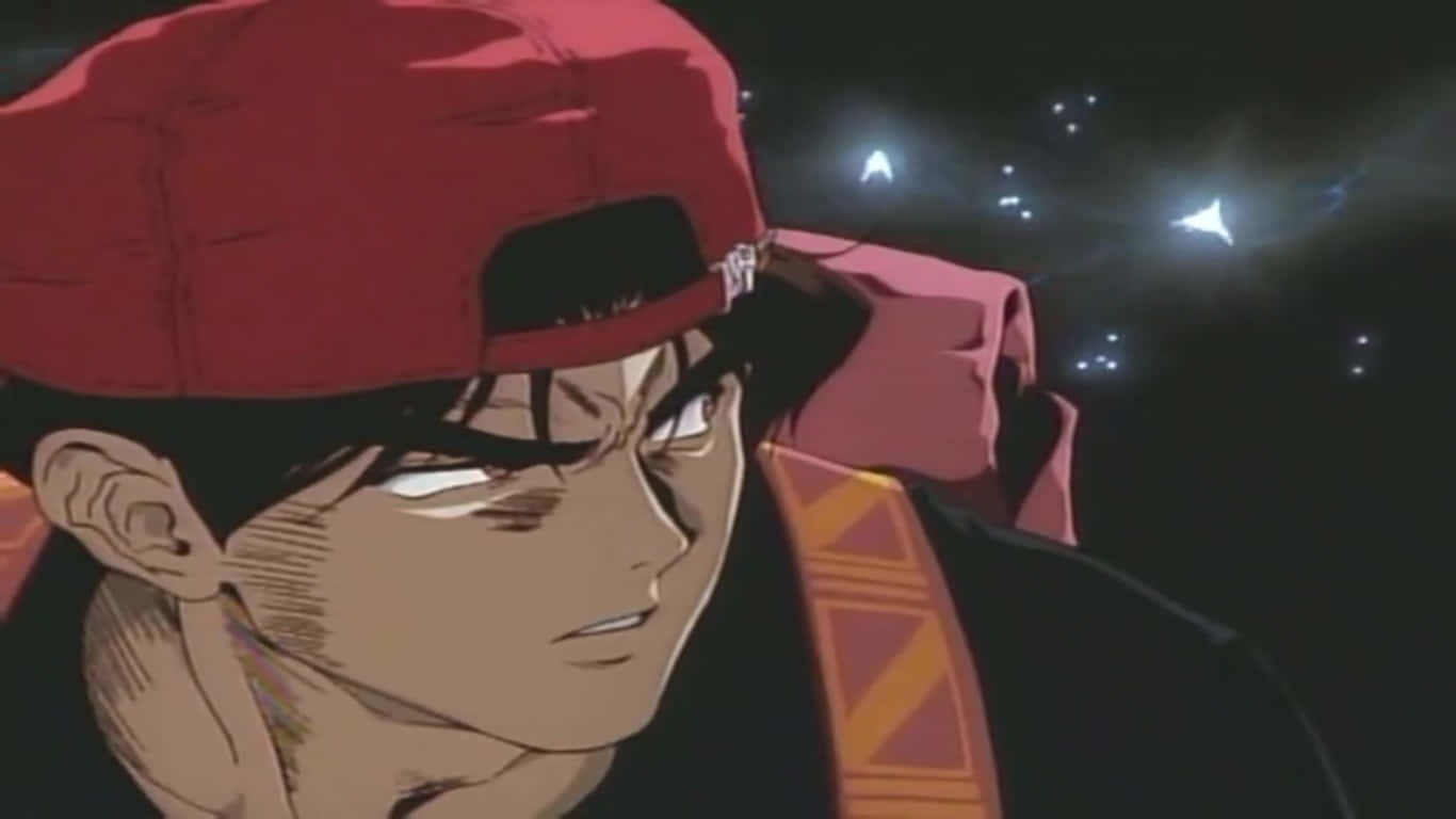 Bad Boy Anime 桌布 壁紙 — 一個決心堅定的動漫籃球運動員，戴著紅色帽子，在夜晚的體育場燈光下凝視著。