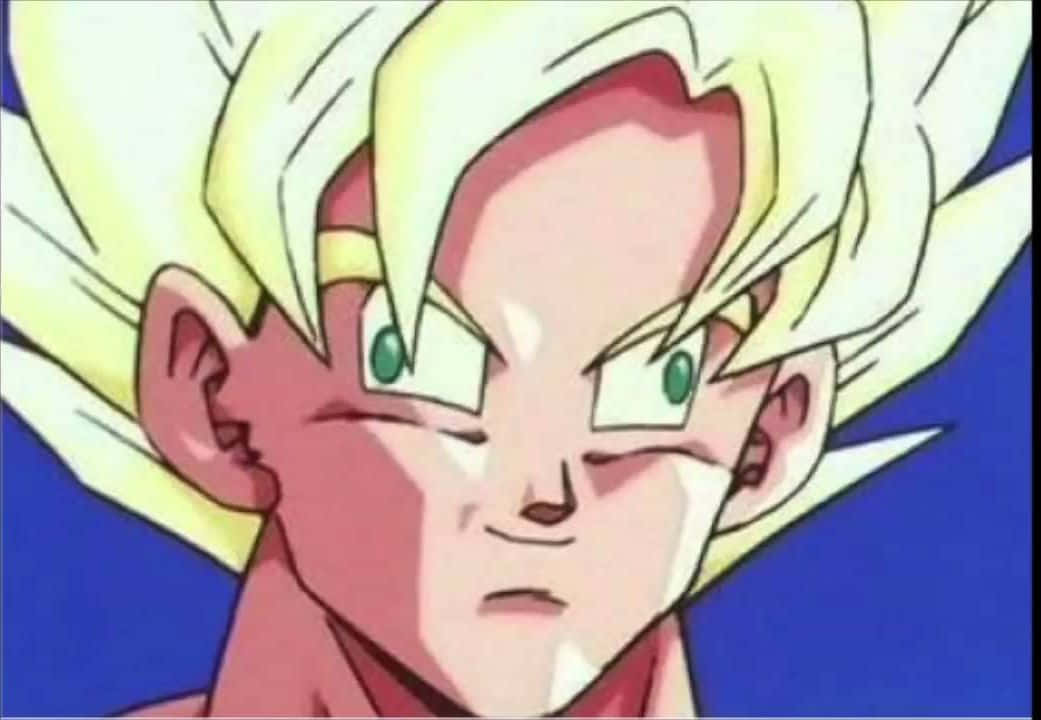 Funny Goku 桌布 壁紙 — 一個決心堅定的動漫角色特寫，擁有尖刺金髮和綠色眼睛，背景為純藍色。