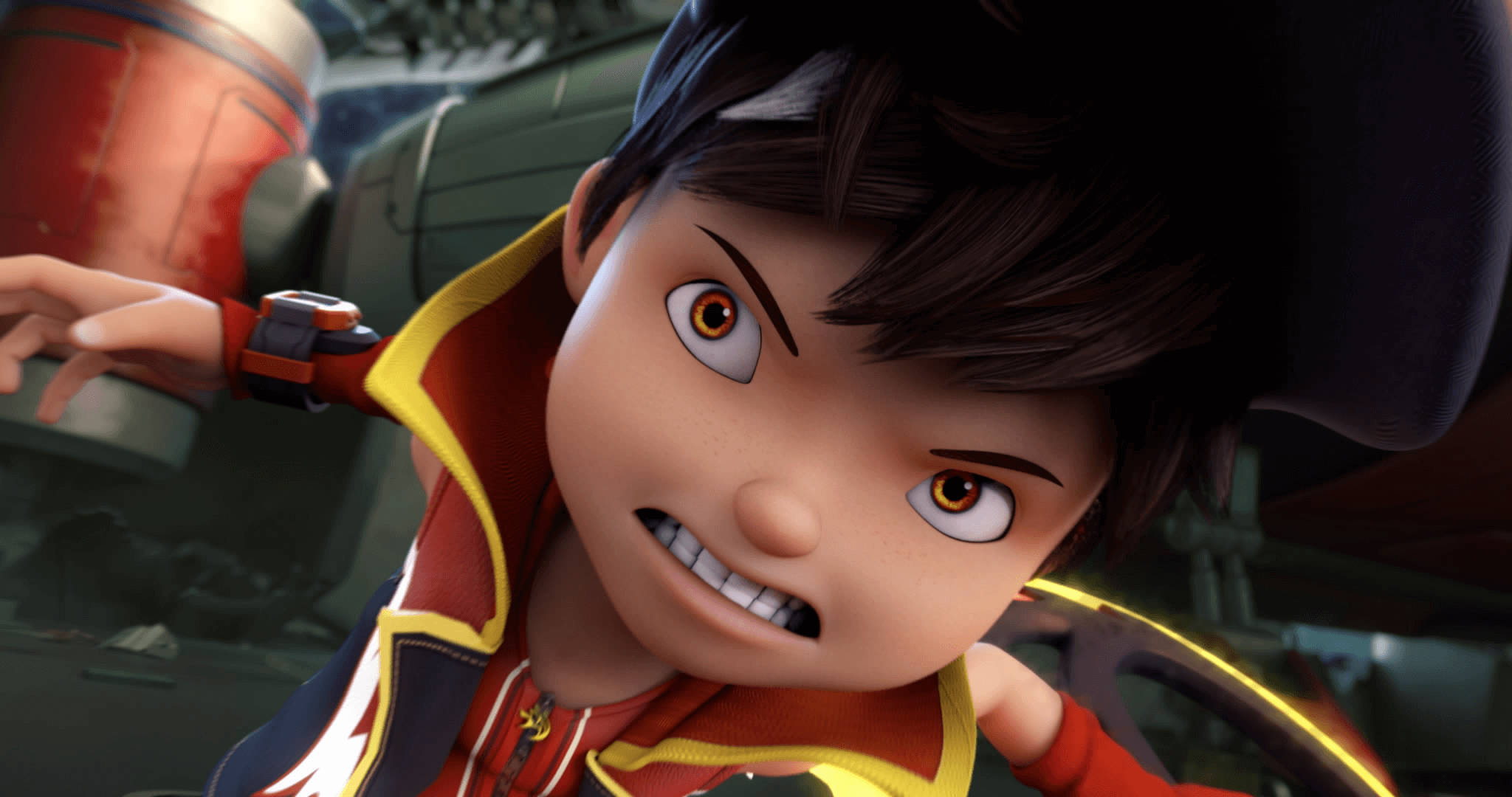 Cartoon Boy 桌布 壁紙 — 一個決心堅定的動畫男孩，棕色頭髮，眼神兇猛，在機械環境中緊握一個紅色和黃色的裝置。