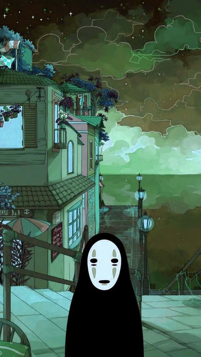 Studio Ghibli Phone 桌布 壁紙 — 一個沉默的蒙面人物在夜晚站在一條寧靜的街道上，下方是繁星點點的綠色天空，周圍有古雅的建築和懸掛的植物。