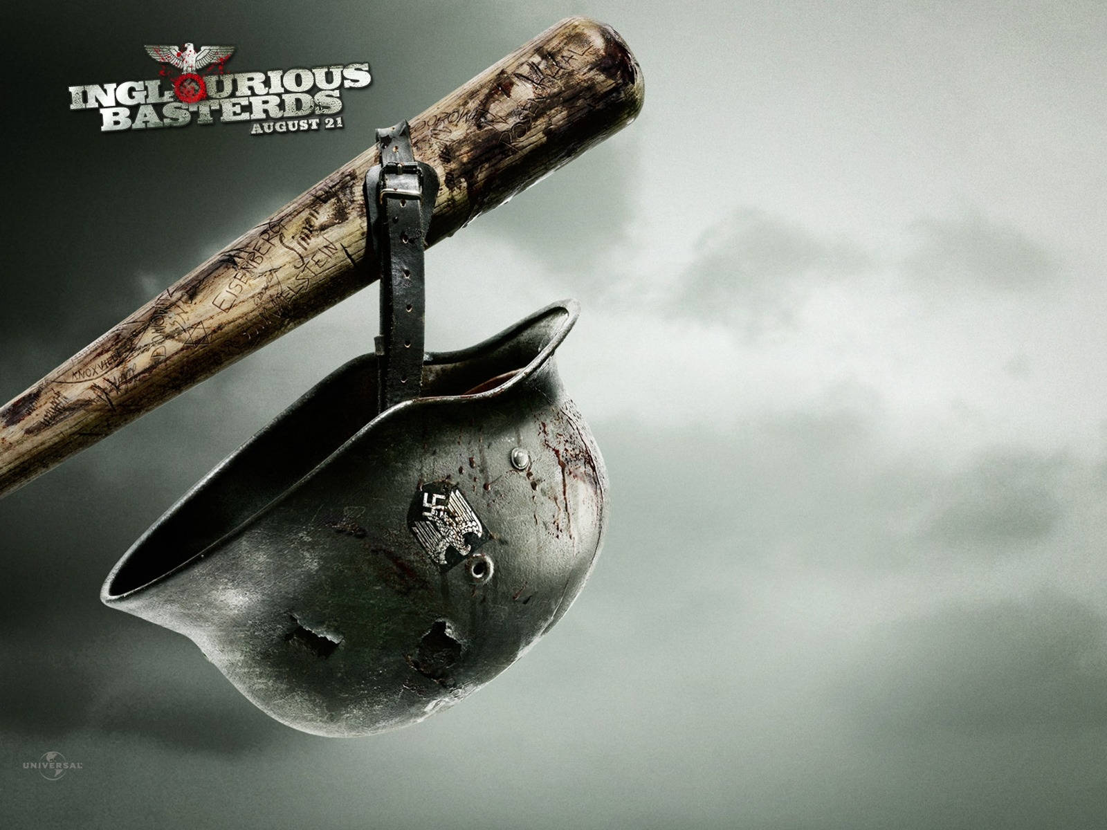 Inglourious Basterds 桌布 壁紙 — 一個沾滿血跡的德國頭盔掛在一根破舊的棒球棍上，背景是暴風雨前的灰色天空。