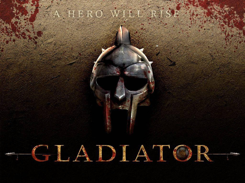 Gladiator 桌布 壁紙 — 一個沾滿血跡的角鬥士頭盔掛在粗糙的牆上，上方有文字「A HERO WILL RISE」，下方有「GLADIATOR」。