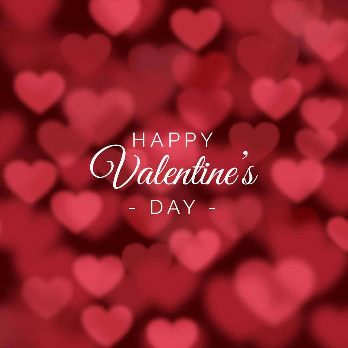 Happy Valentines Day 桌布 壁紙 — 一個浪漫的情人節問候，白色草書文字在紅色心形狀的柔焦背景上。