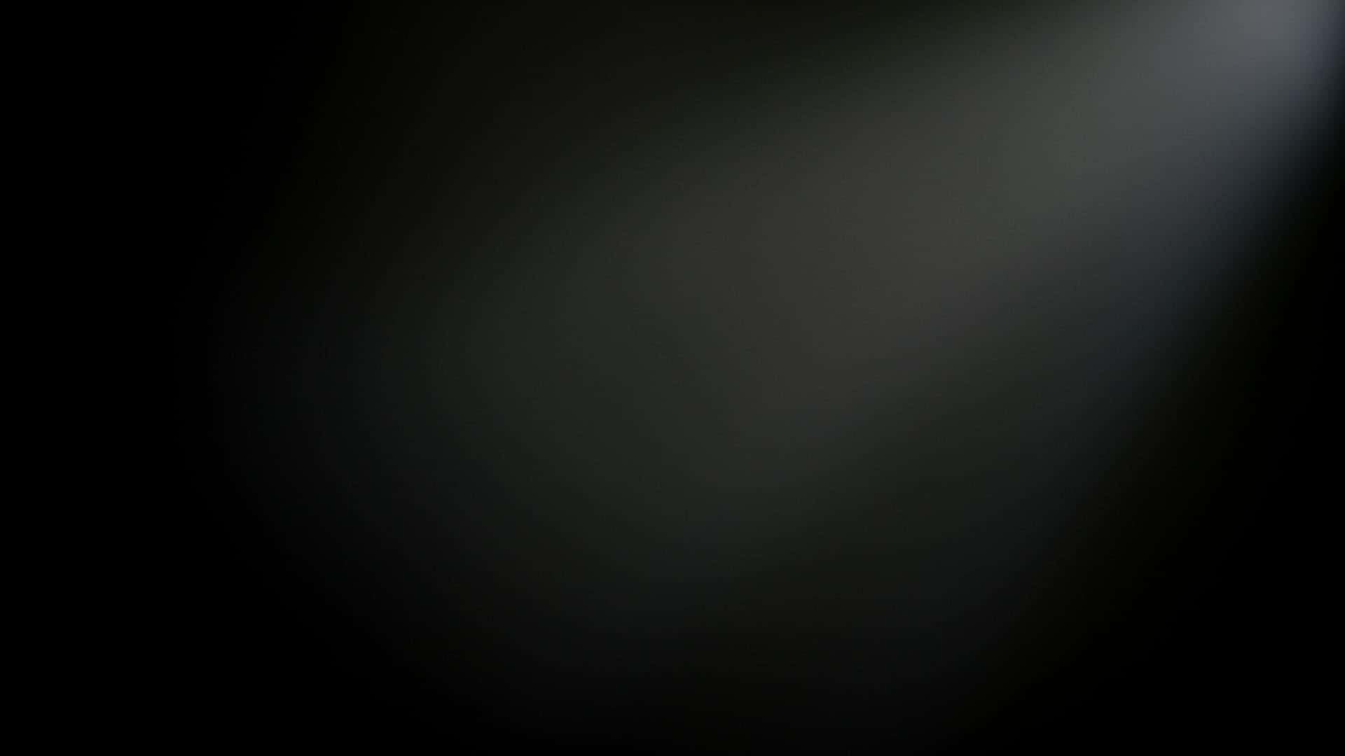 Black Ombre 桌布 壁紙 — 一個深色漸變背景，右上角有柔和發光的光源。