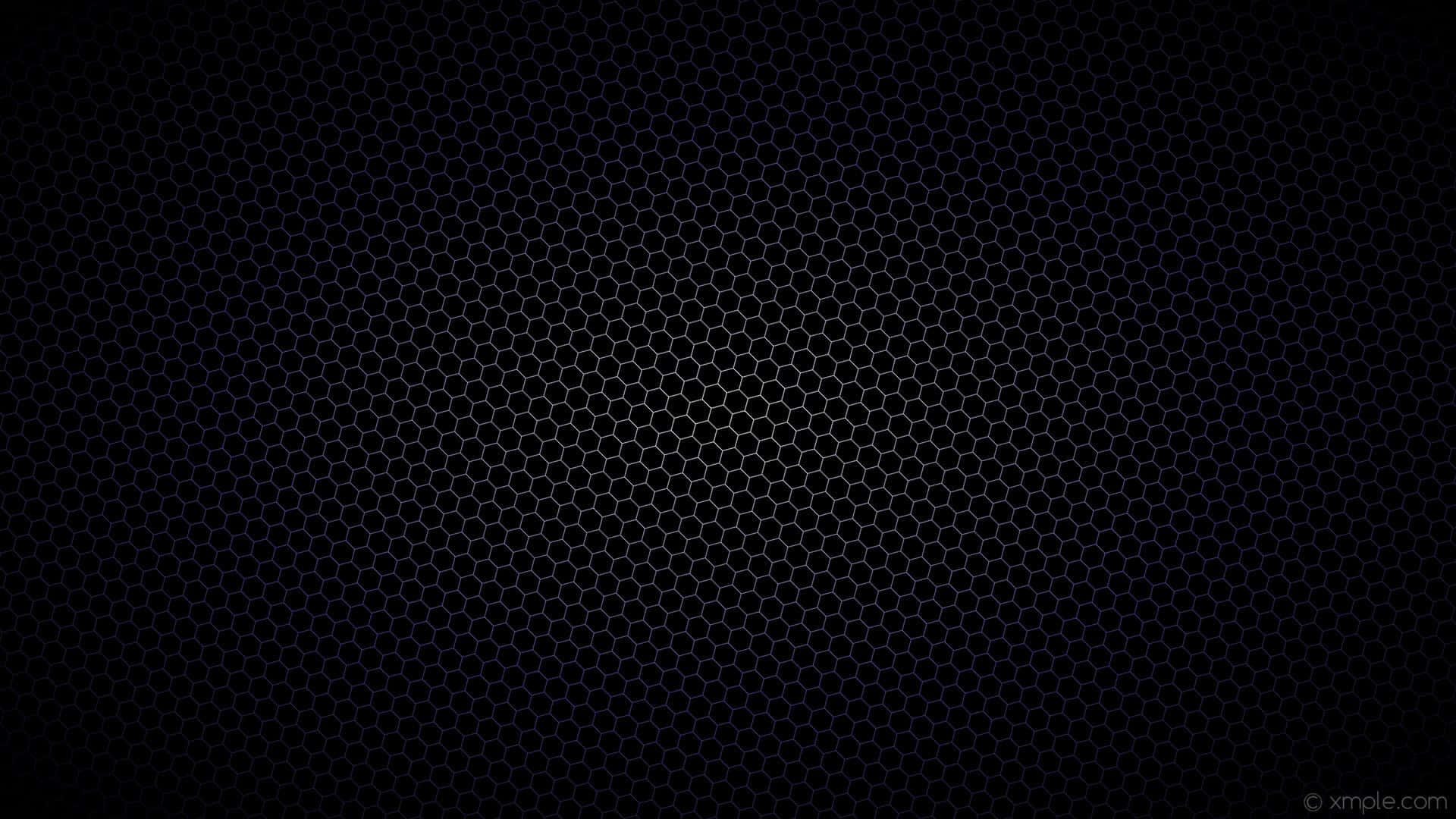 Black Gradient 桌布 壁紙 — 一個深色背景，中央帶有微弱發光的六角形網格圖案。