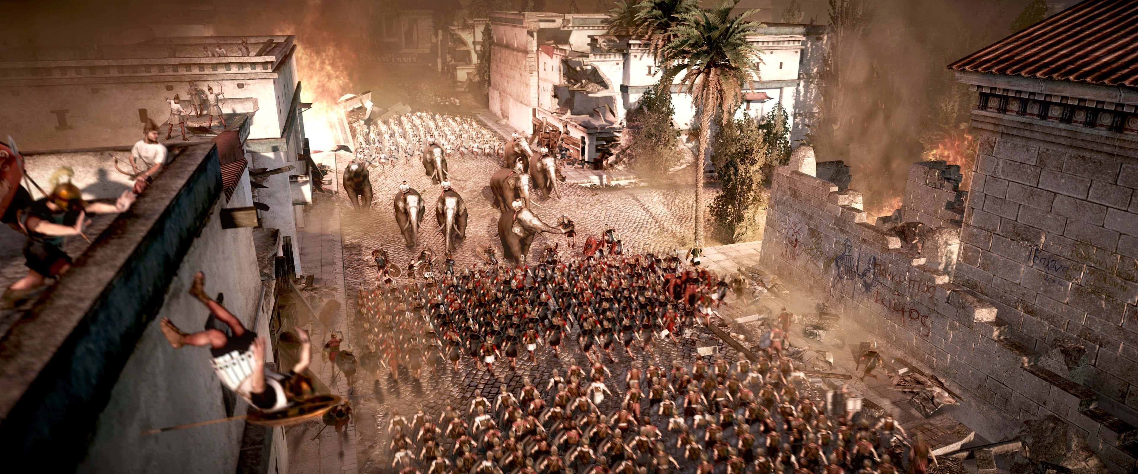Total War Rome 2 桌布 壁紙 — 一個混亂的古代戰場，士兵們在燃燒的城市街道上戰鬥，大象衝過人群。