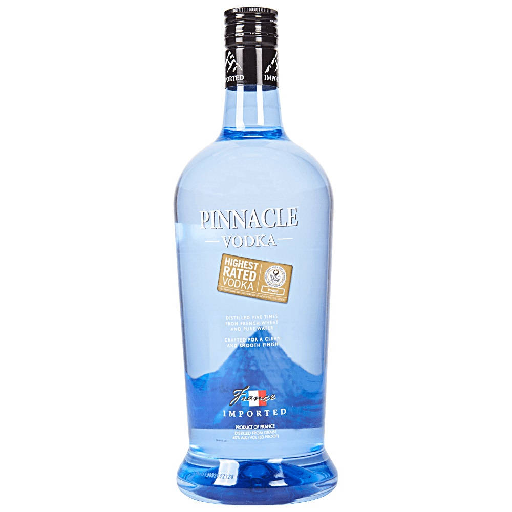 bottle 桌布 壁紙 — 一個清晰的藍色瓶子，裝有 Pinnacle Vodka，帶有山脈圖像和「最高評級伏特加」標籤，背景為白色。