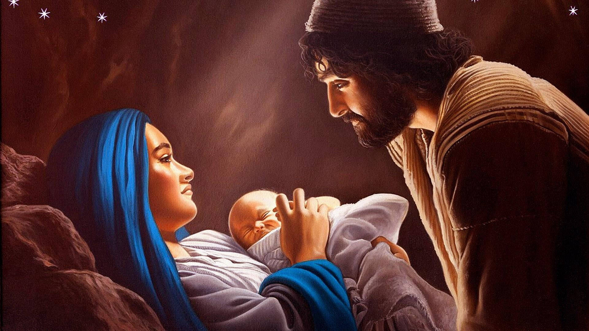 Christ 桌布 壁紙 — 一個溫馨的宗教場景，描繪瑪利亞身穿藍色長袍懷抱嬰兒耶穌，約瑟在昏暗的洞穴中滿懷敬意地俯視。