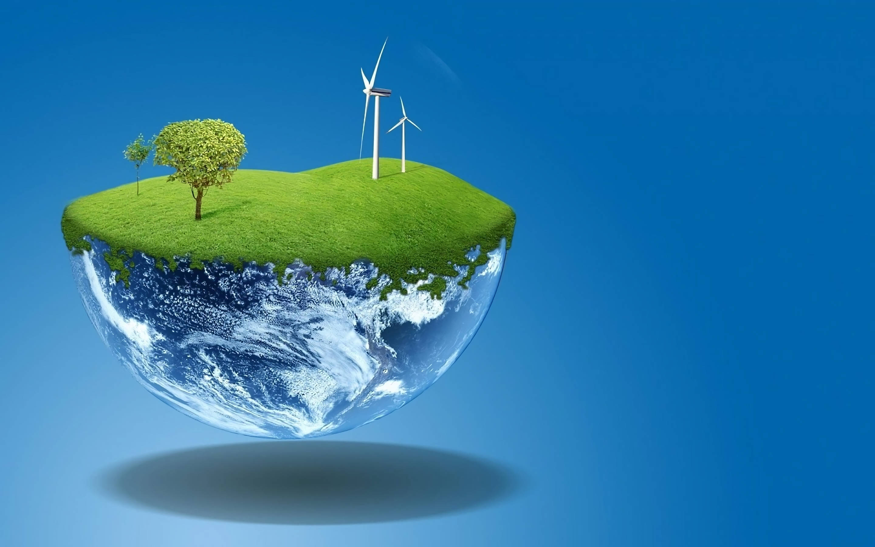 Earth Day 桌布 壁紙 — 一個漂浮的半地球儀，上面有綠色的草樹和風力渦輪機，背景是清澈的藍天。
