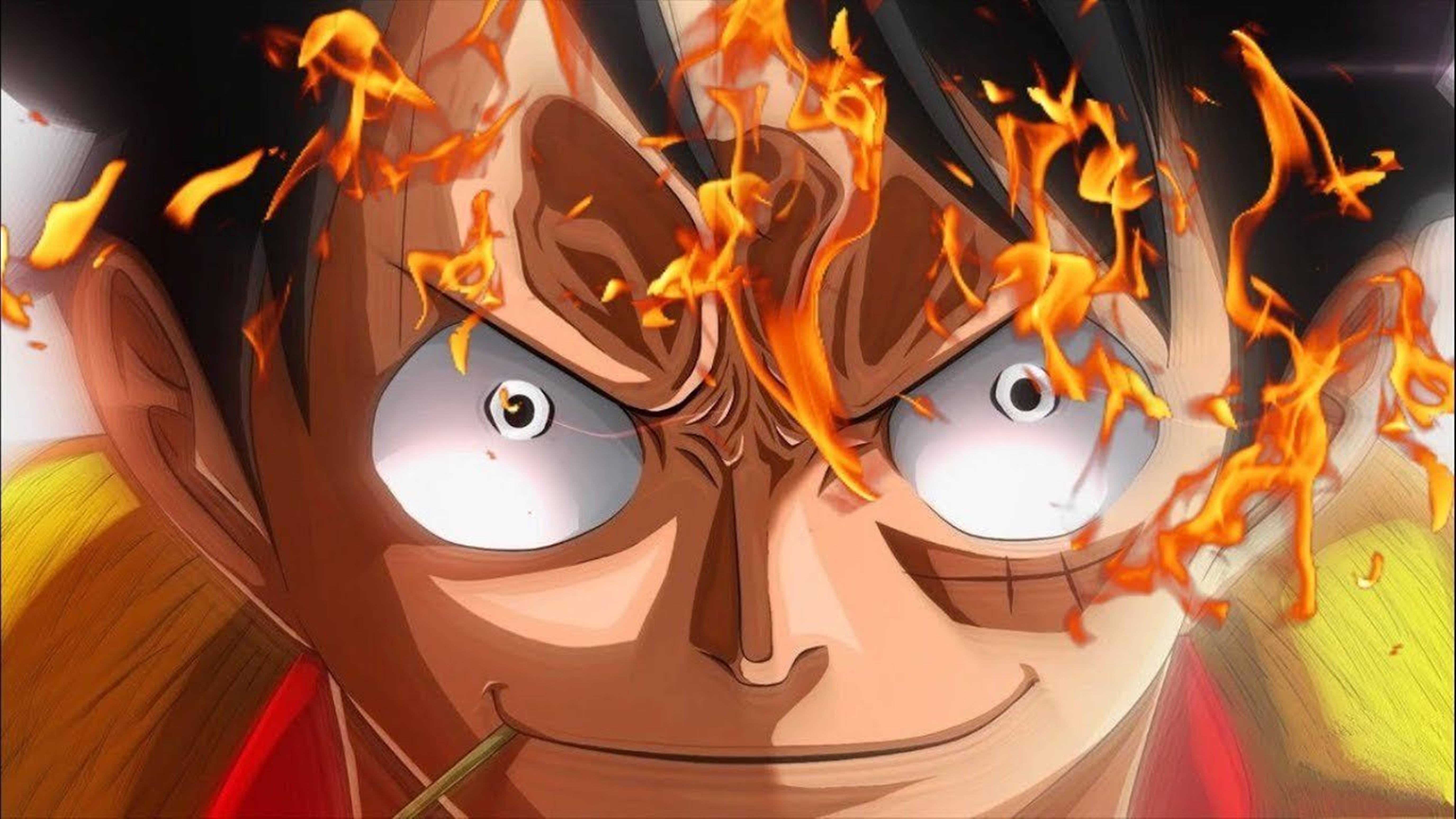 Luffy 桌布 壁紙 — 一個火熱的動漫角色，眼神強烈，火焰從他的頭部爆發出來，形成動態特寫。