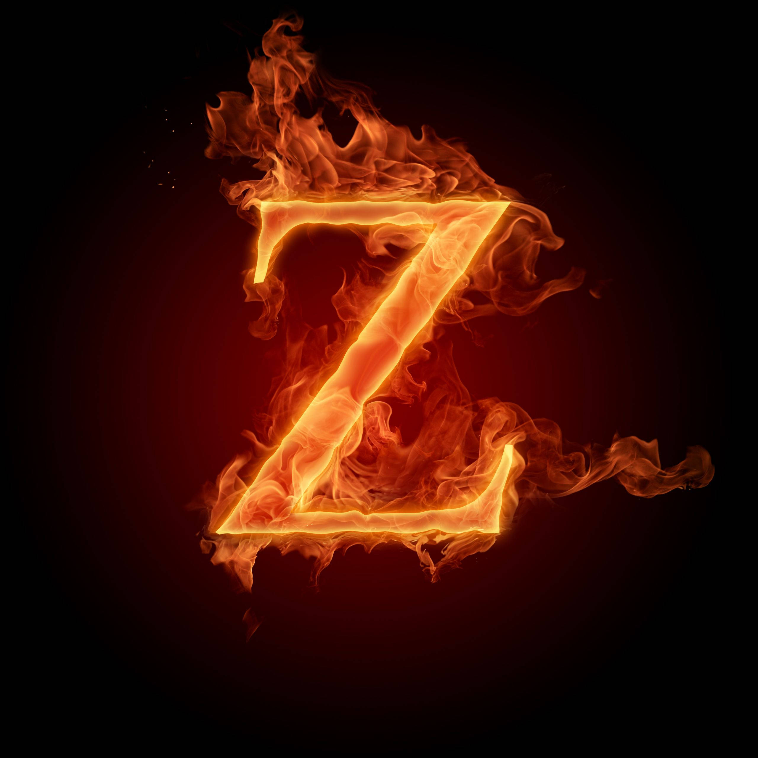 Z 桌布 壁紙 — 一個熾熱的字母Z在黑暗背景中燃燒，帶有鮮豔的橙色火焰和發光的餘燼。