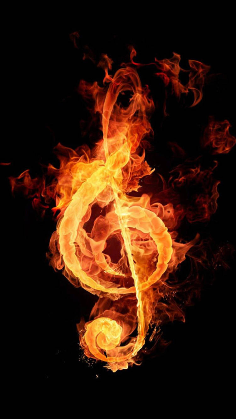 Red Fire 桌布 壁紙 — 一個熾熱的高音譜號在黑色背景上明亮地燃燒，伴隨著旋轉的橙色和黃色火焰。