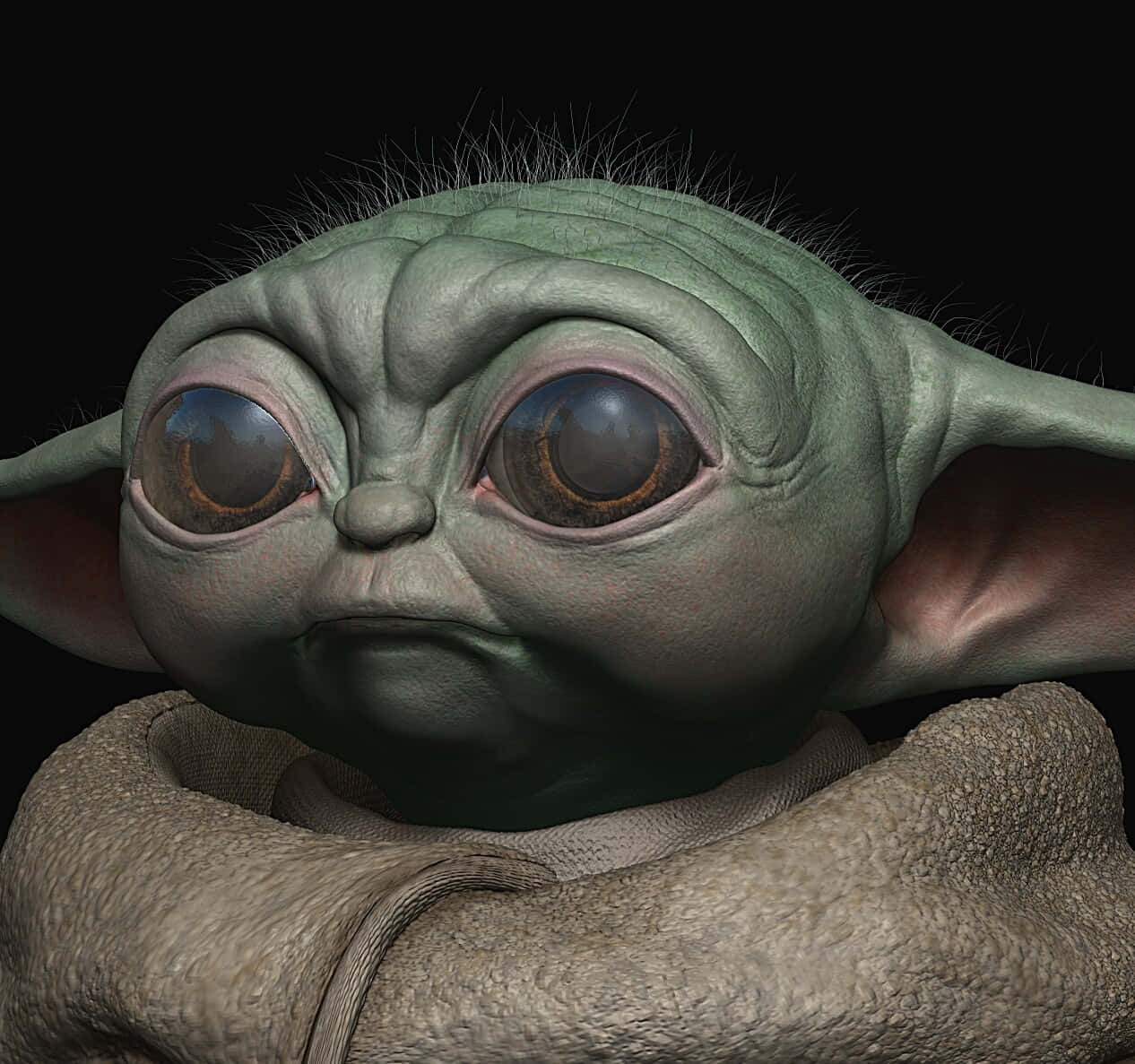 Star Wars Characters 桌布 壁紙 — 一個特寫鏡頭，一個綠色皮膚的嬰兒外星人，擁有大而富有表情的眼睛，包裹在質感斗篷中，背景為黑色。