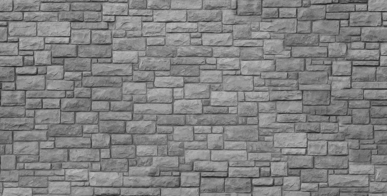 wall 桌布 壁紙 — 一個特寫鏡頭，展示帶有各種矩形石塊和自然風化表面的紋理灰色石牆。