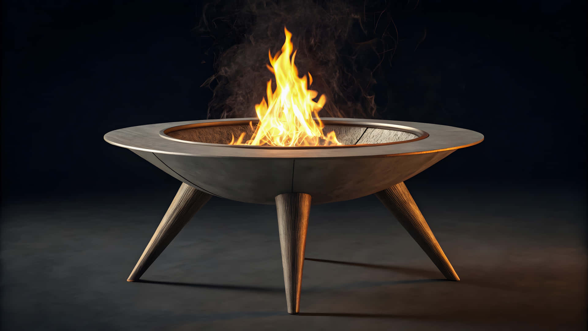 Modern fire pit with burning flames against a dark background 壁紙 — 一個現代金屬火坑，帶有四條錐形腿，在黑暗背景下明亮地燃燒。