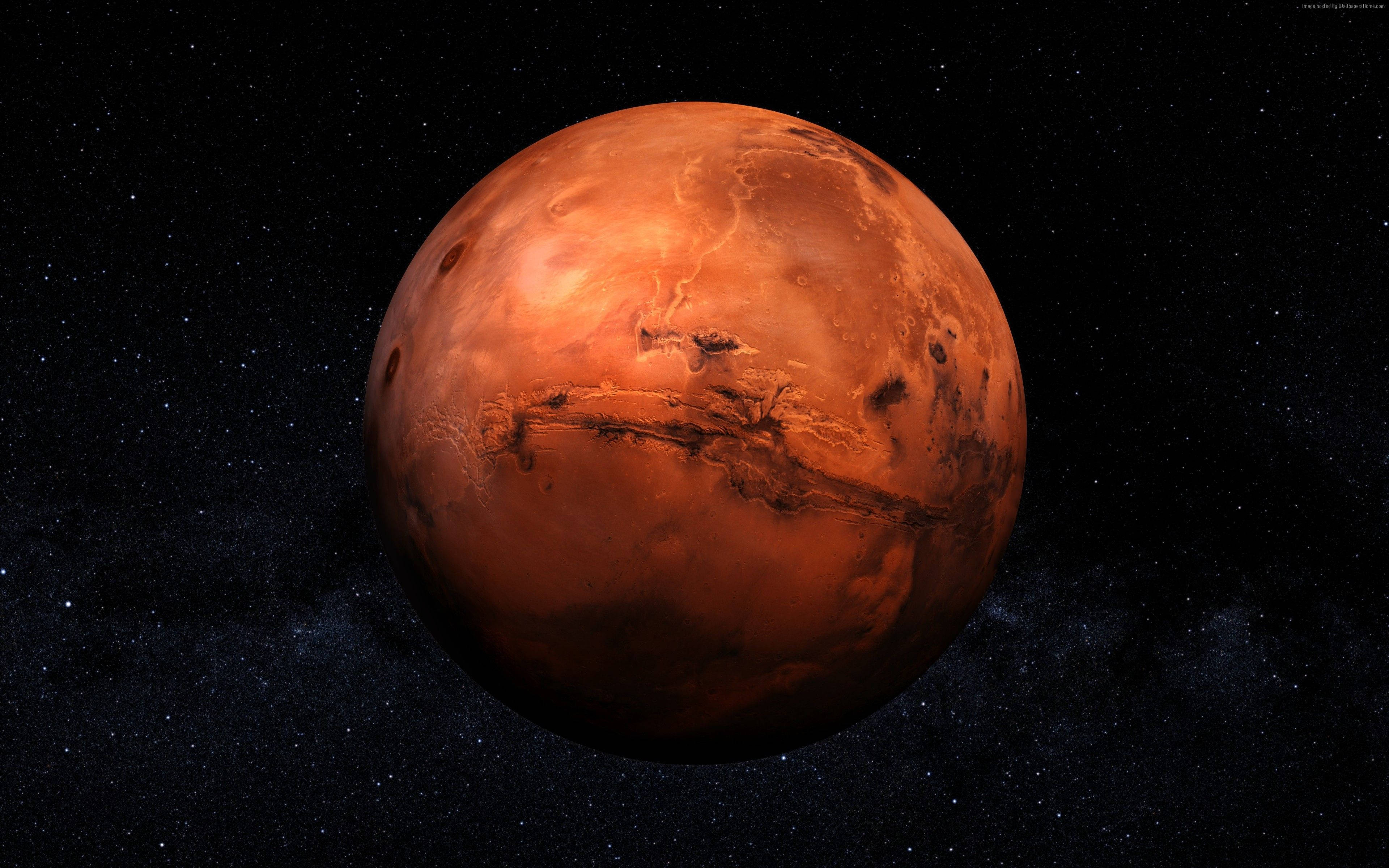 火星 桌布 壁紙 — 一個生動渲染的火星，在佈滿星星的宇宙虛空中發出橙色光芒，表面特徵清晰可見。