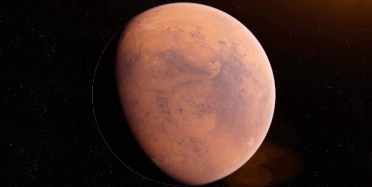 Mars Planet 桌布 壁紙 — 一個生動渲染的火星行星在佈滿星星的黑色虛空中發出鏽橙色光芒。