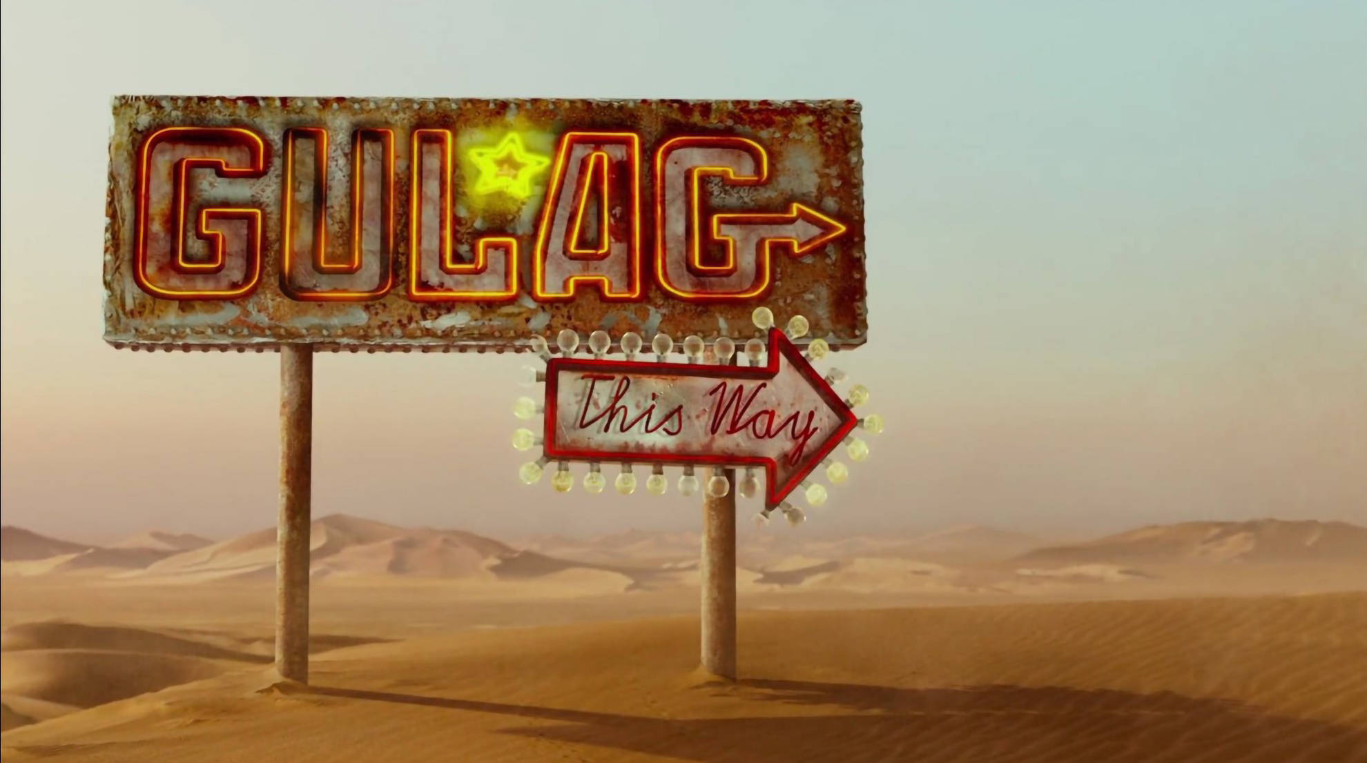 muppets 桌布 壁紙 — 一個生鏽的霓虹燈牌，上面寫著「GULAG」，帶有發光的星星和箭頭，指向朦朧天空下的沙漠地平線。