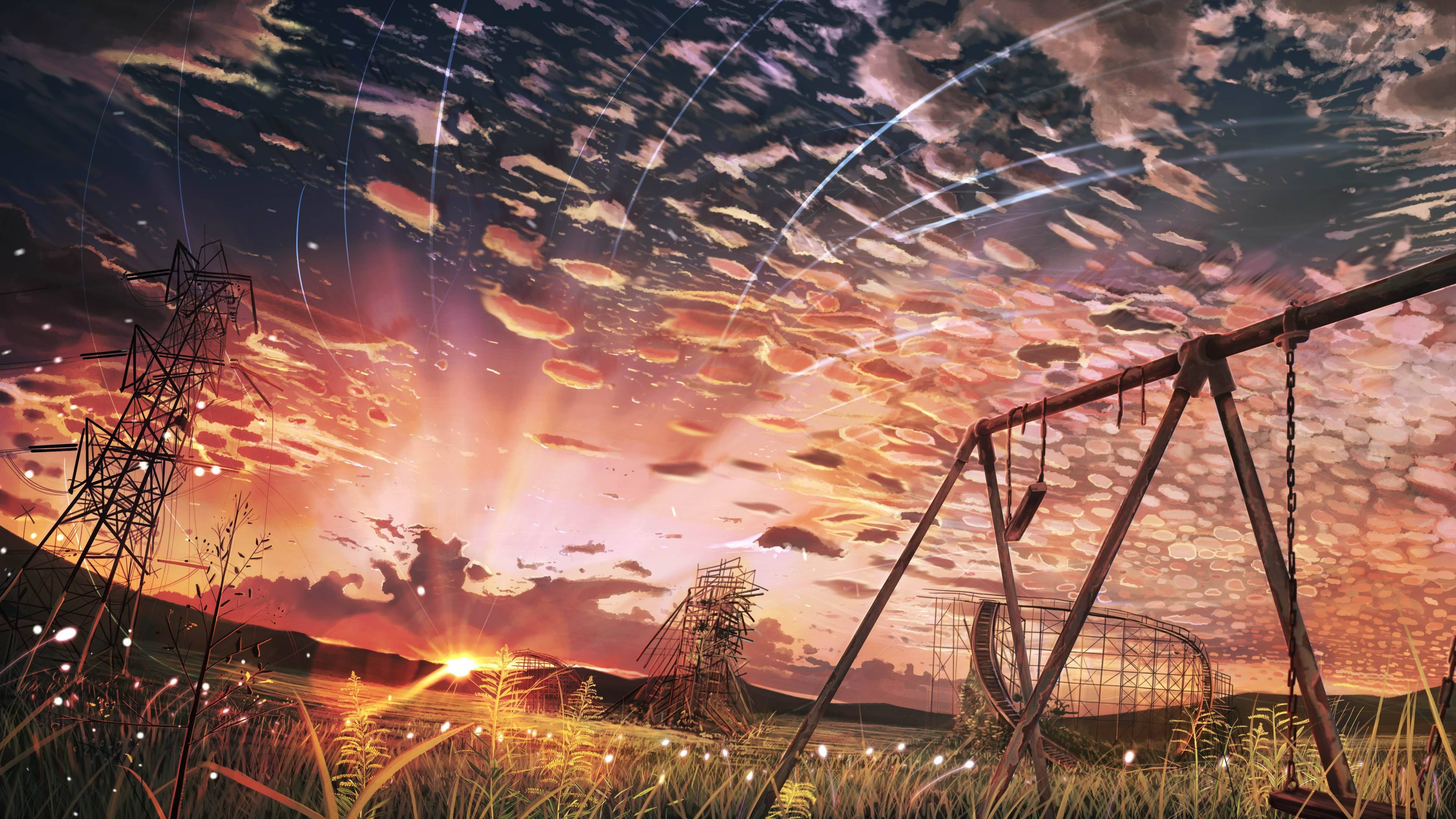 Playground 桌布 壁紙 — 一個生鏽的鞦韆架矗立在日落時分的田野中，伴隨著電線和充滿宇宙光線條紋的鮮豔天空。