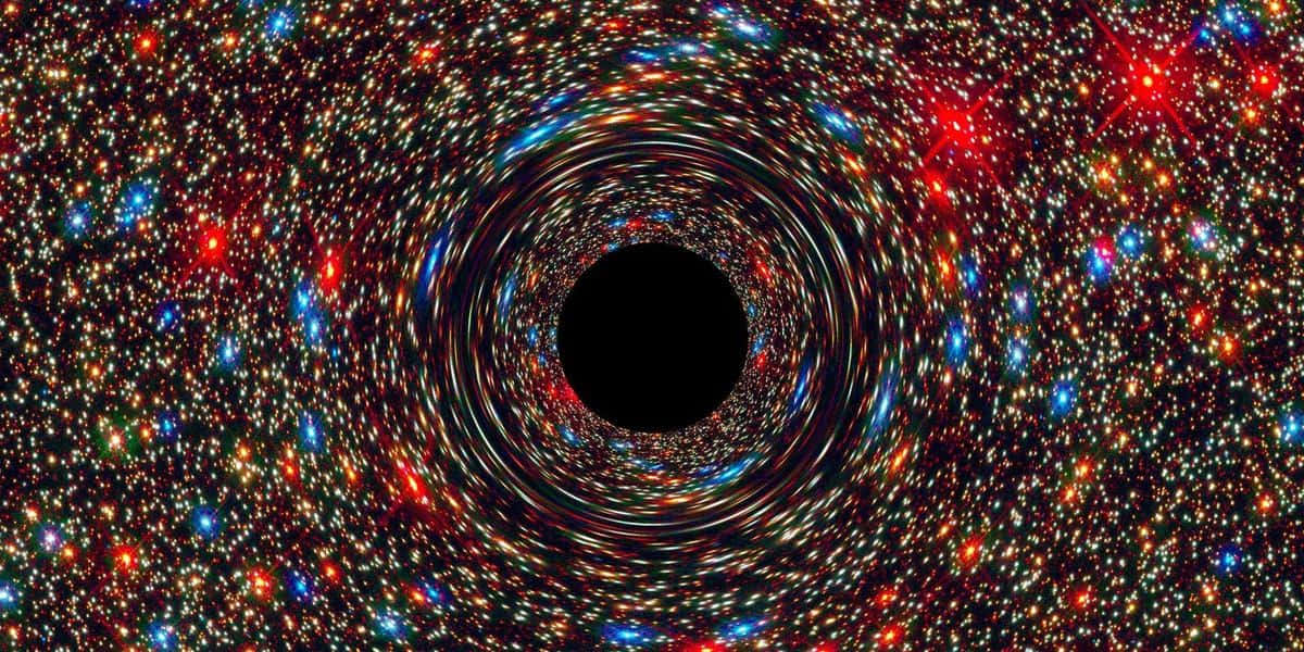 Black Hole Sun 桌布 壁紙 — 一個由充滿活力的恆星和星系組成的旋轉宇宙隧道，螺旋向內朝向一個黑色虛空。