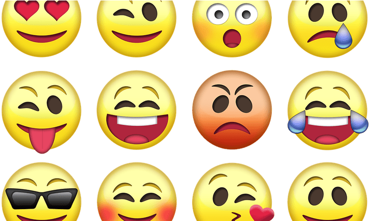 Emoticon 桌布 壁紙 — 一個由十二個色彩繽紛的表情符號臉孔組成的網格，在黑色背景上展示各種俏皮且富有表現力的情緒。