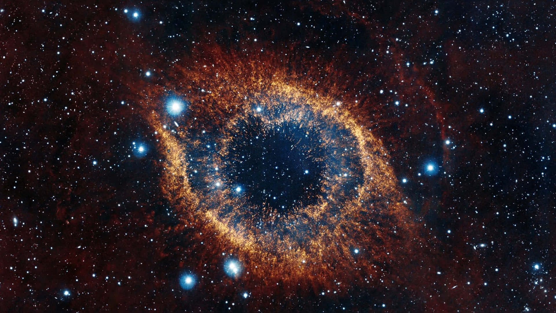 太空 桌布 壁紙 — 一個由發光的橙色和藍色氣體環組成的宇宙之眼，背景是深空中的星場。