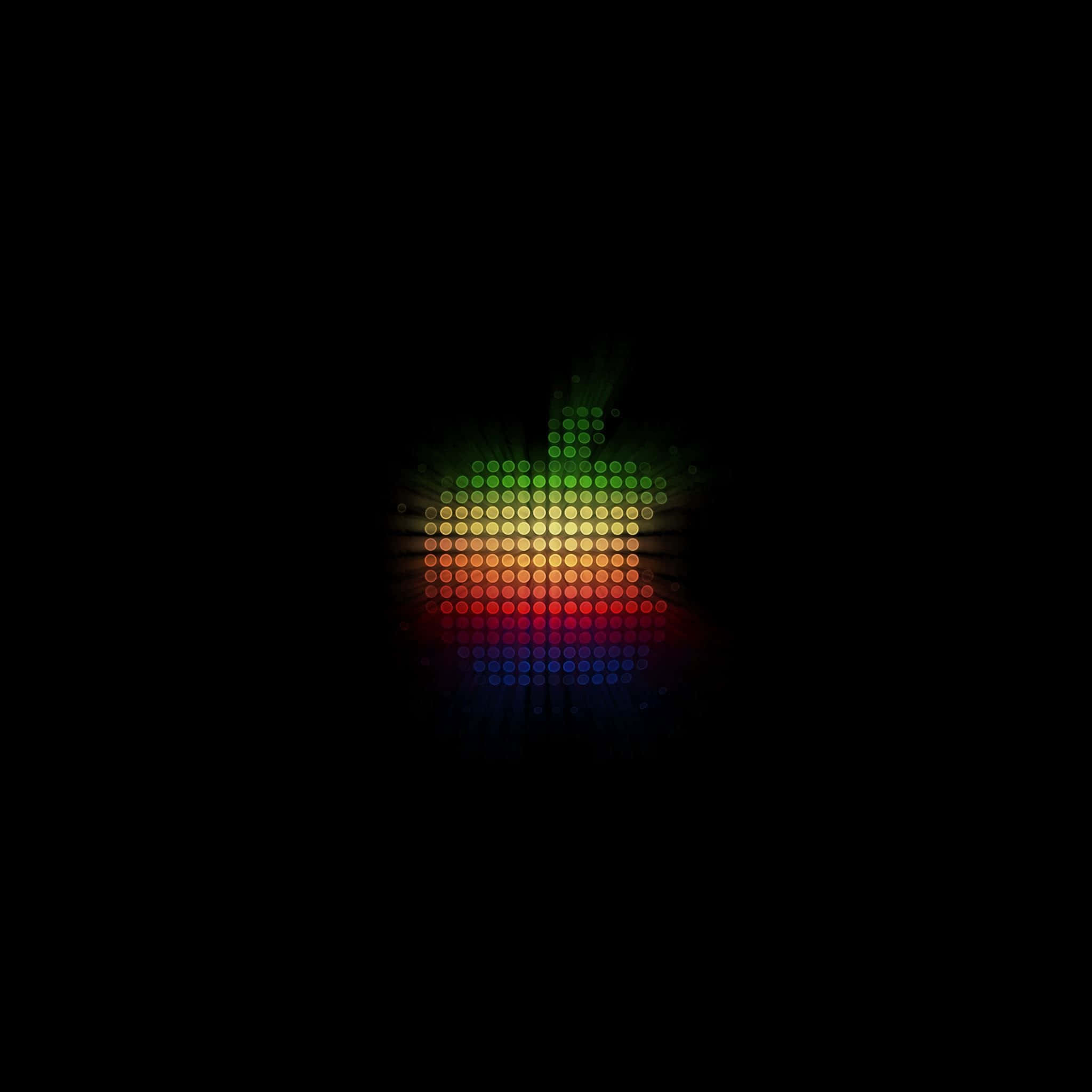 Dot 桌布 壁紙 — 一個由發光點組成的鮮豔彩虹色Apple標誌，在純黑色背景上散發光芒。