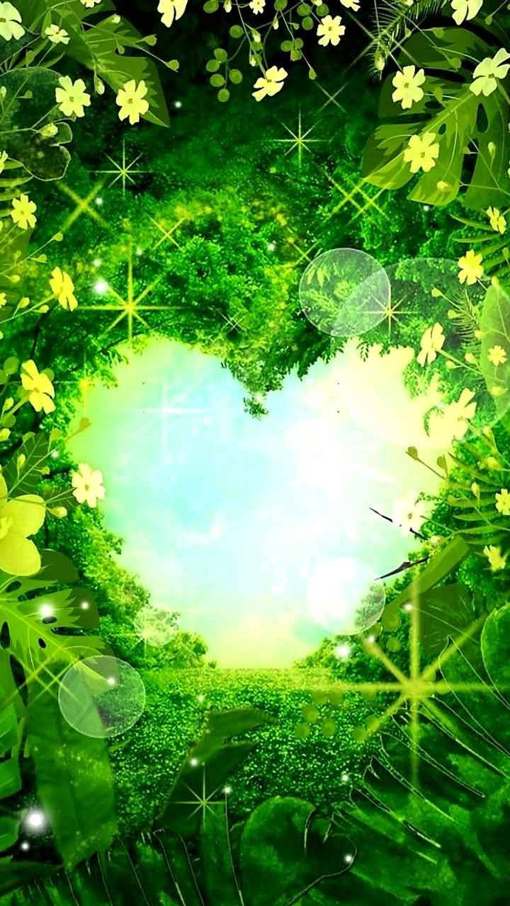 Nature Love 桌布 壁紙 — 一個由茂密綠葉和黃花組成的心形框架，展現出背後閃爍的天空。