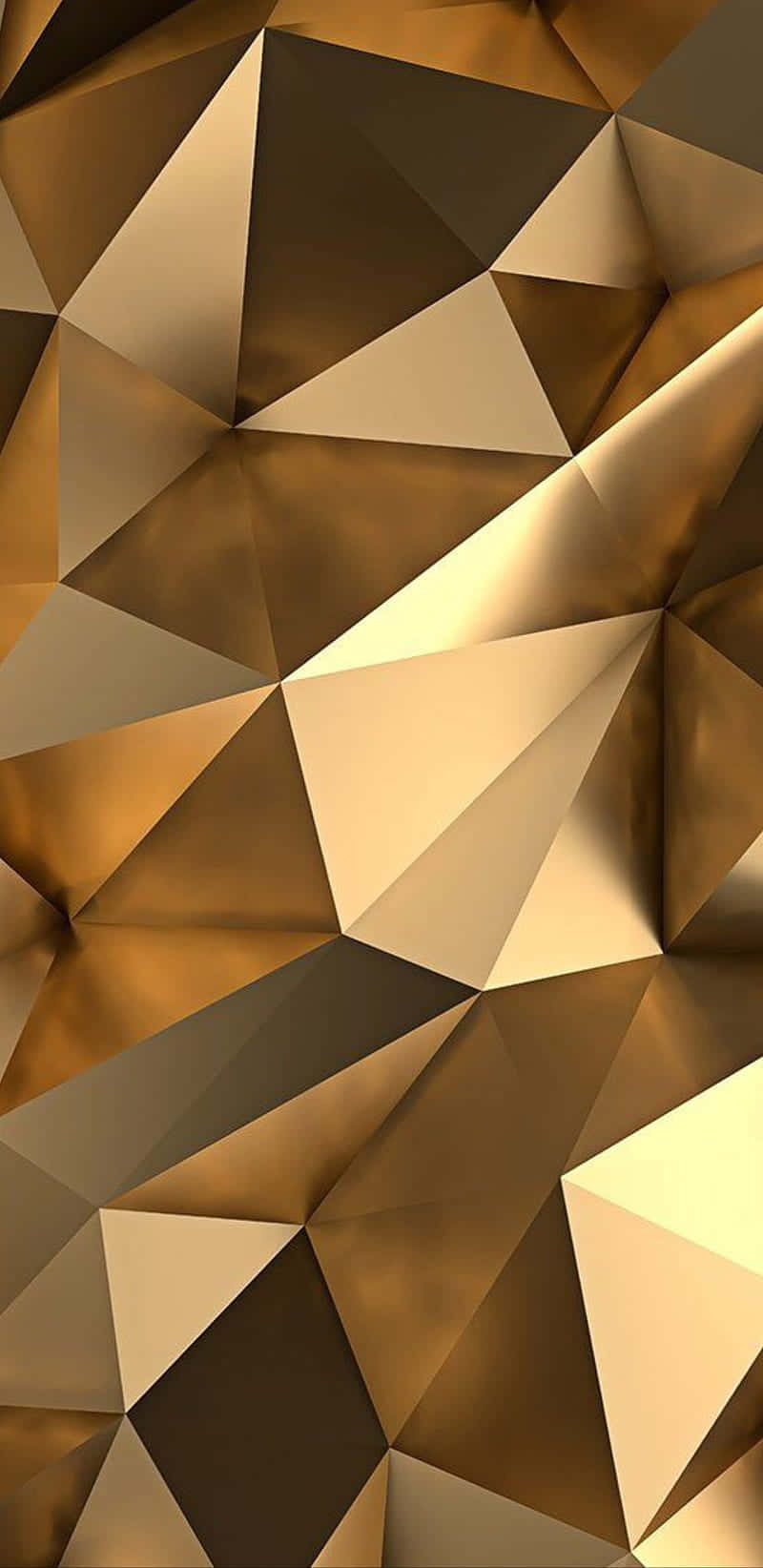 Metallic Gold 桌布 壁紙 — 一個由金色和青銅色三角形交織而成的動態抽象圖案，帶有銳利的陰影和高光。