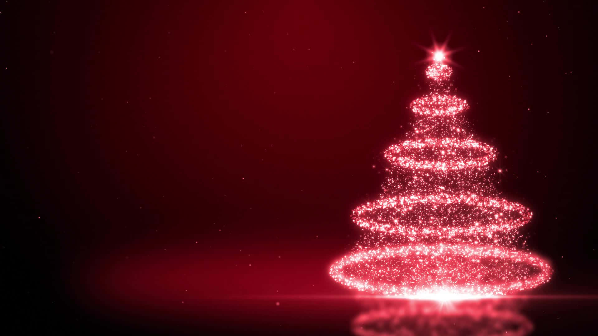 聖誕樹動畫 桌布 壁紙 — 一個由閃爍粒子組成的發光紅色聖誕樹，在深紅色漸變背景上明亮地閃耀。