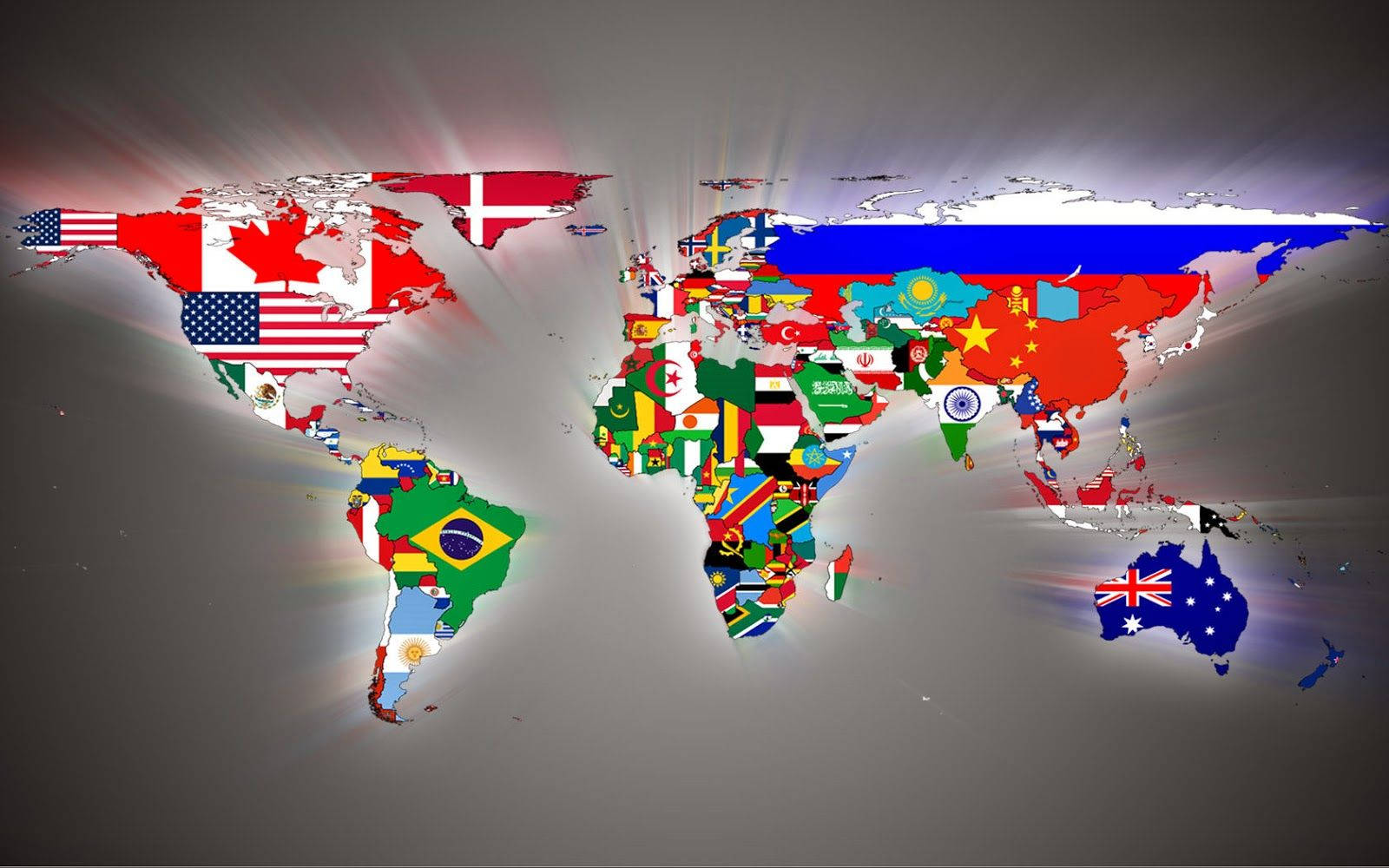 World 桌布 壁紙 — 一個由鮮豔國旗組成的世界地圖，從每個大陸發出光芒四射的光束。