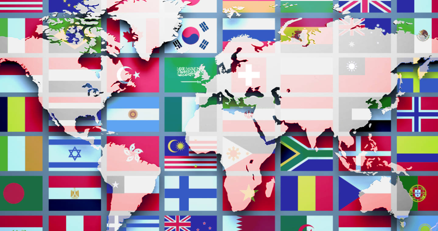 Flag 桌布 壁紙 — 一個由鮮豔的國旗組成、以網格排列覆蓋各大洲的世界地圖。