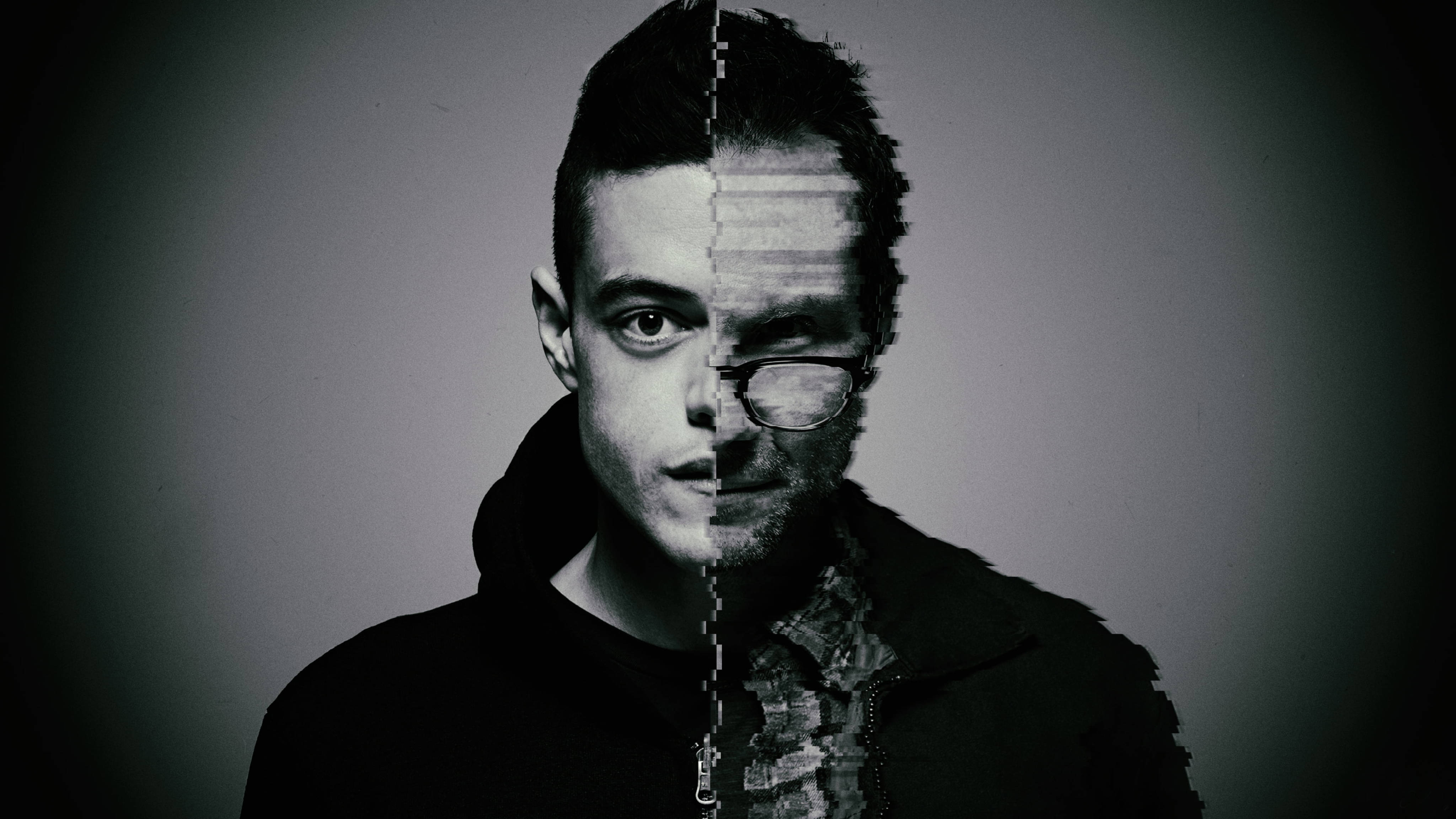 Mr Robot 桌布 壁紙 — 一個男人的臉從中間分開，一側清晰，另一側以黑白呈現故障和像素化效果。