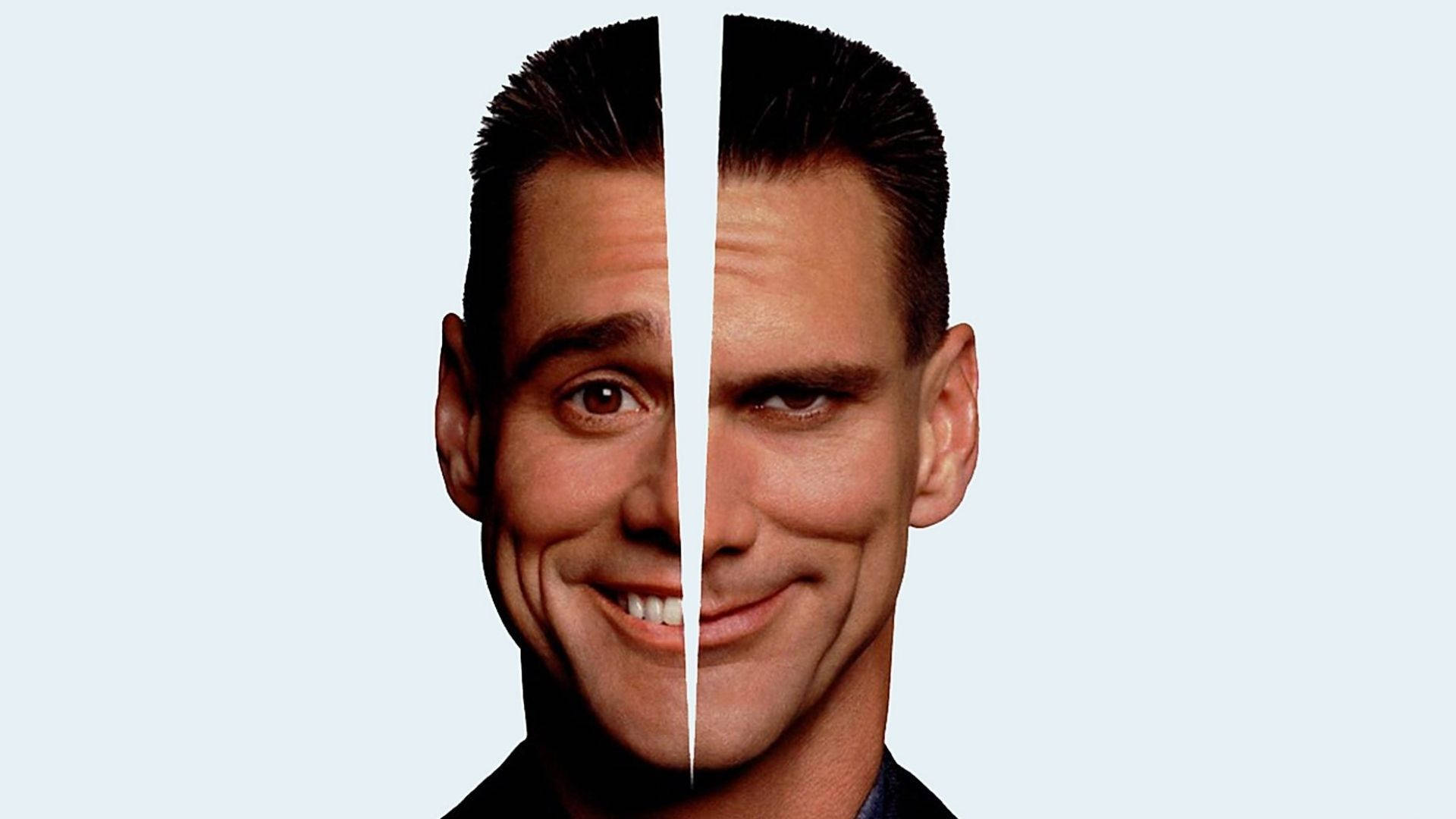 Jim Carrey 桌布 壁紙 — 一個男人的臉從中間分開，一邊微笑，另一邊皺眉，背景是淺藍色。
