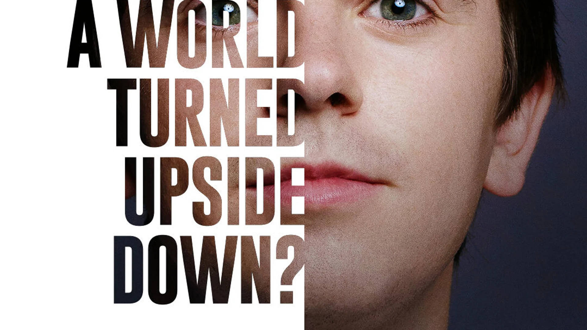 The Good Doctor 桌布 壁紙 — 一個男人臉部的特寫肖像，被粗體文字 'A WORLD TURNED UPSIDE DOWN?' 分割，他的眼睛反射出森林場景。