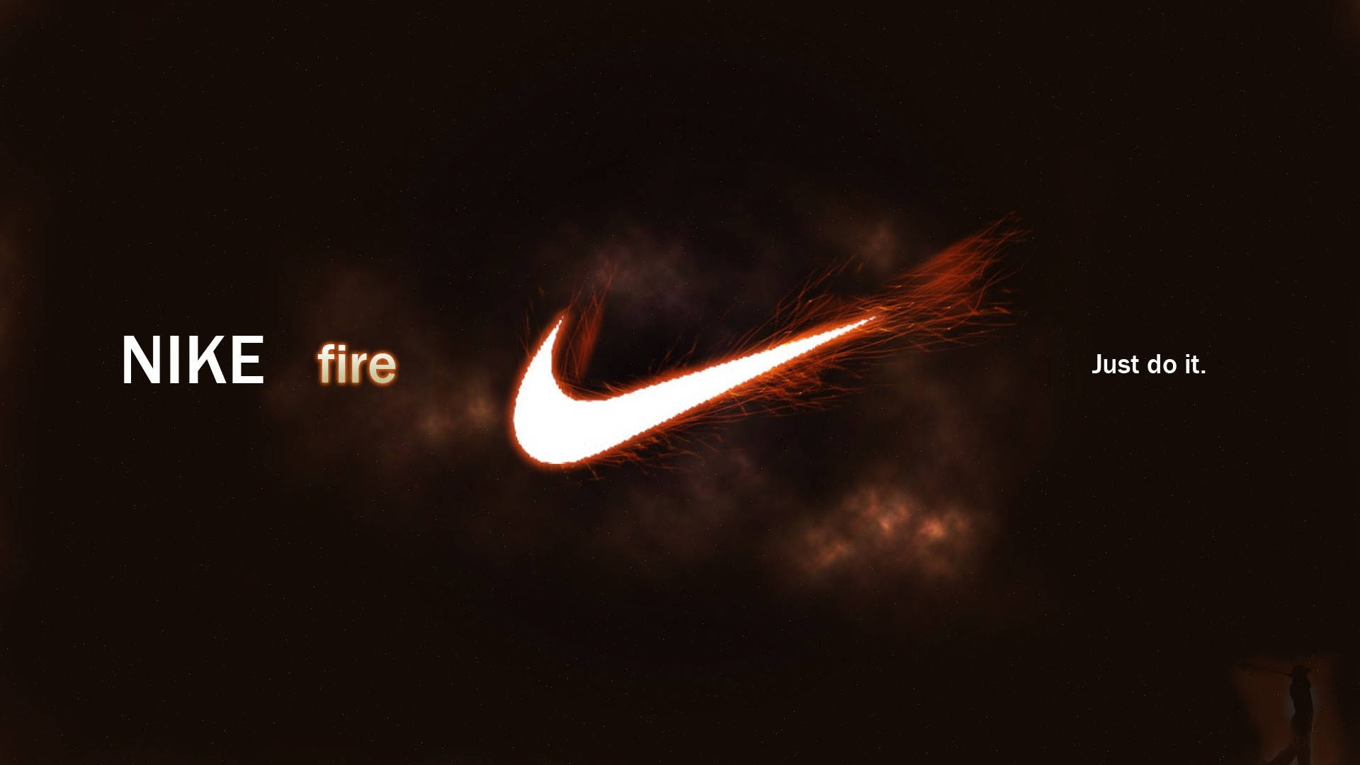 HD Sports 桌布 壁紙 — 一個發光、熾熱的Nike勾勾在黑暗煙霧背景中燃燒，帶有「NIKE fire」和「Just do it.」文字。