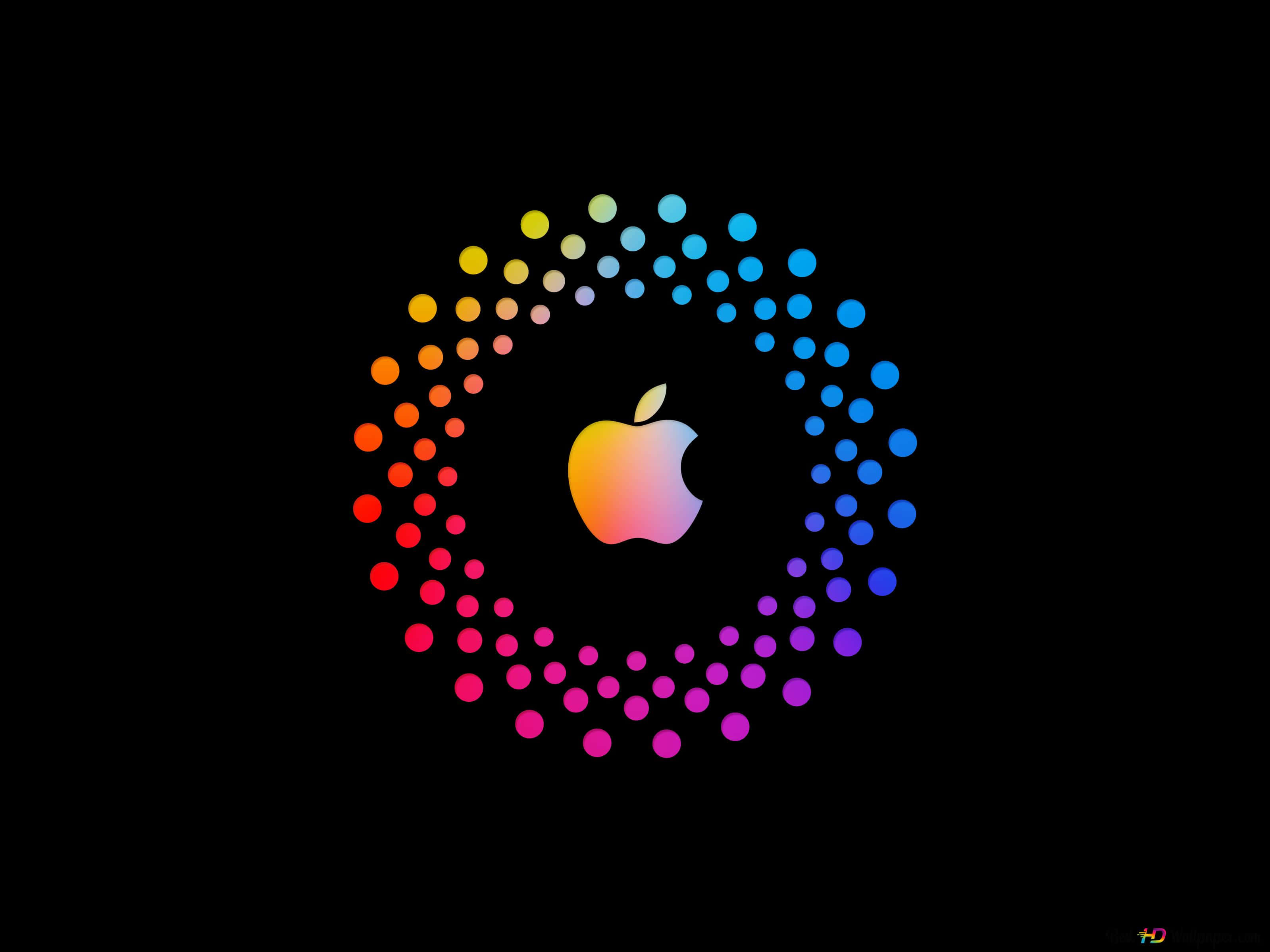 蘋果 桌布 壁紙 — 一個發光的Apple標誌，被鮮豔的彩虹點環圍繞，背景為黑色。