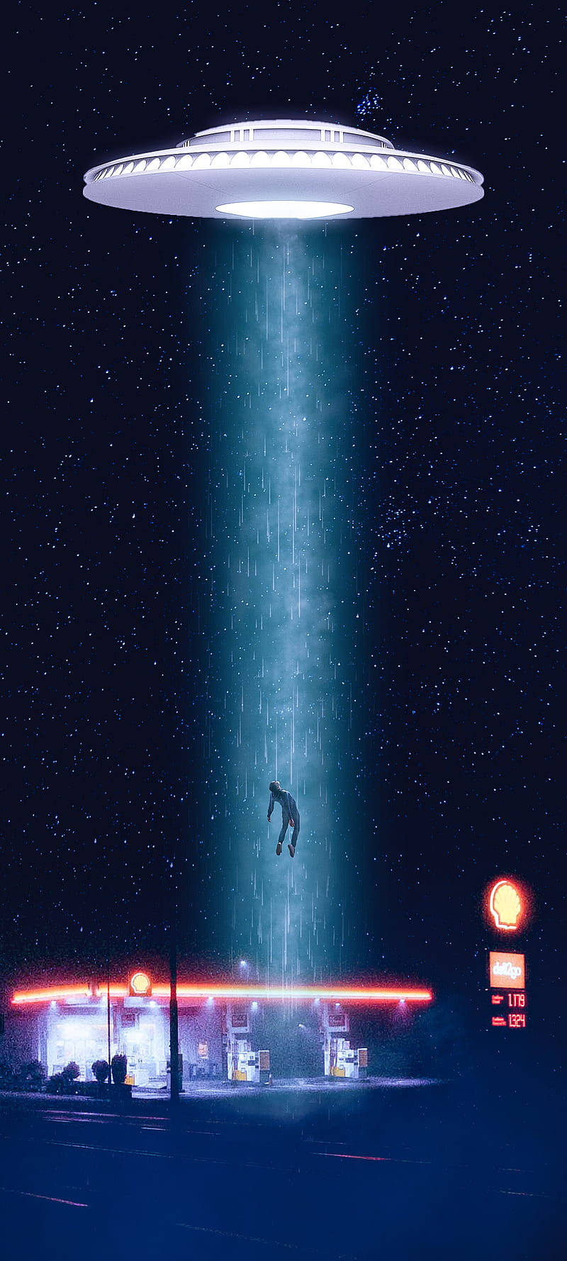 幽浮 桌布 壁紙 — 一個發光的UFO在夜間盤旋在霓虹加油站上空，透過光束將一個人向上拉，背景是星空。