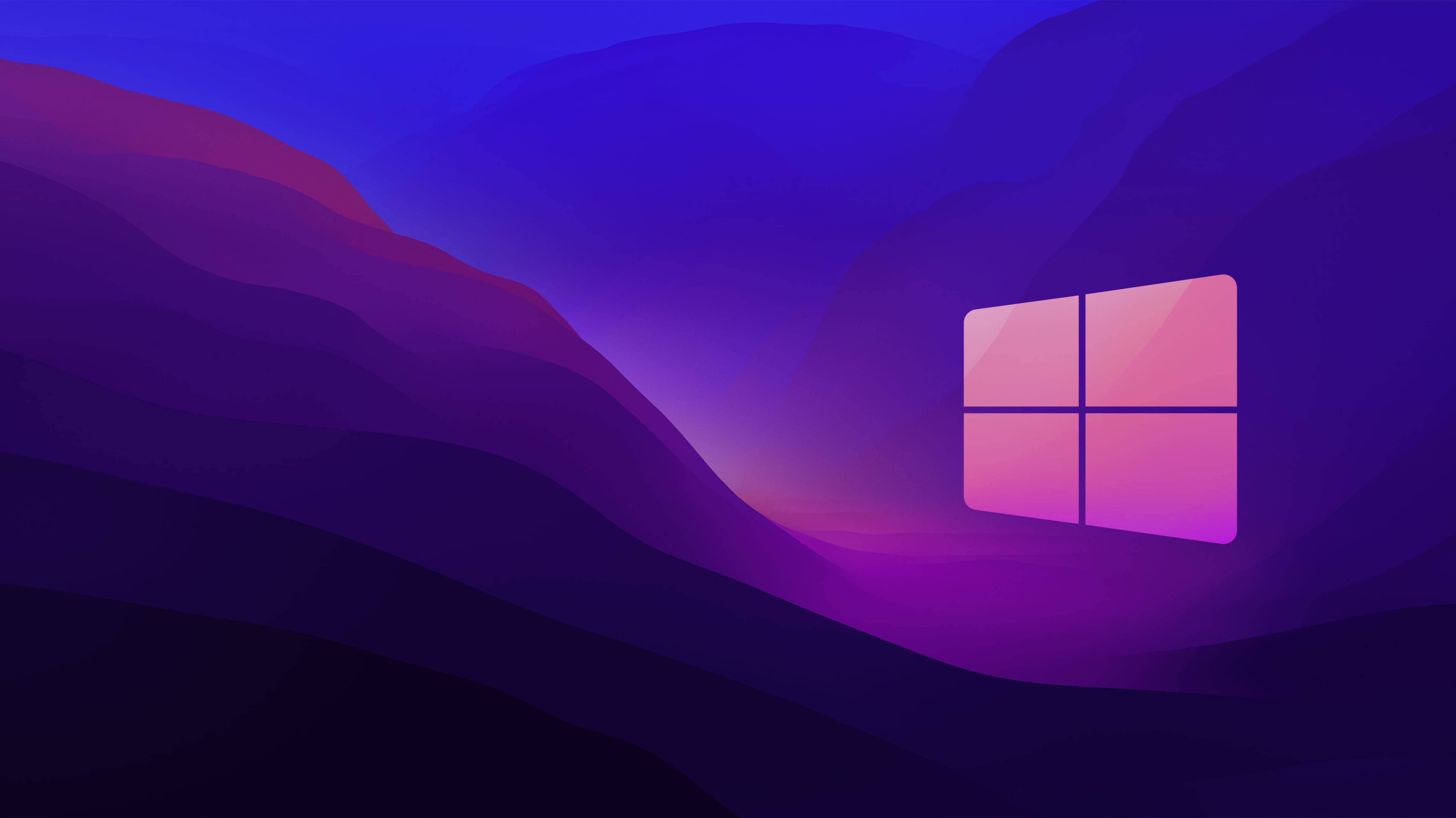 Windows 10 桌布 壁紙 — 一個發光的Windows標誌漂浮在風格化的紫色山谷中，天空呈現漸變色。