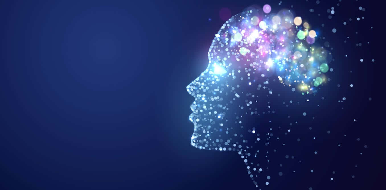 Brain 桌布 壁紙 — 一個發光的人類頭部剪影，充滿閃爍的彩色燈光，背景為深藍色。