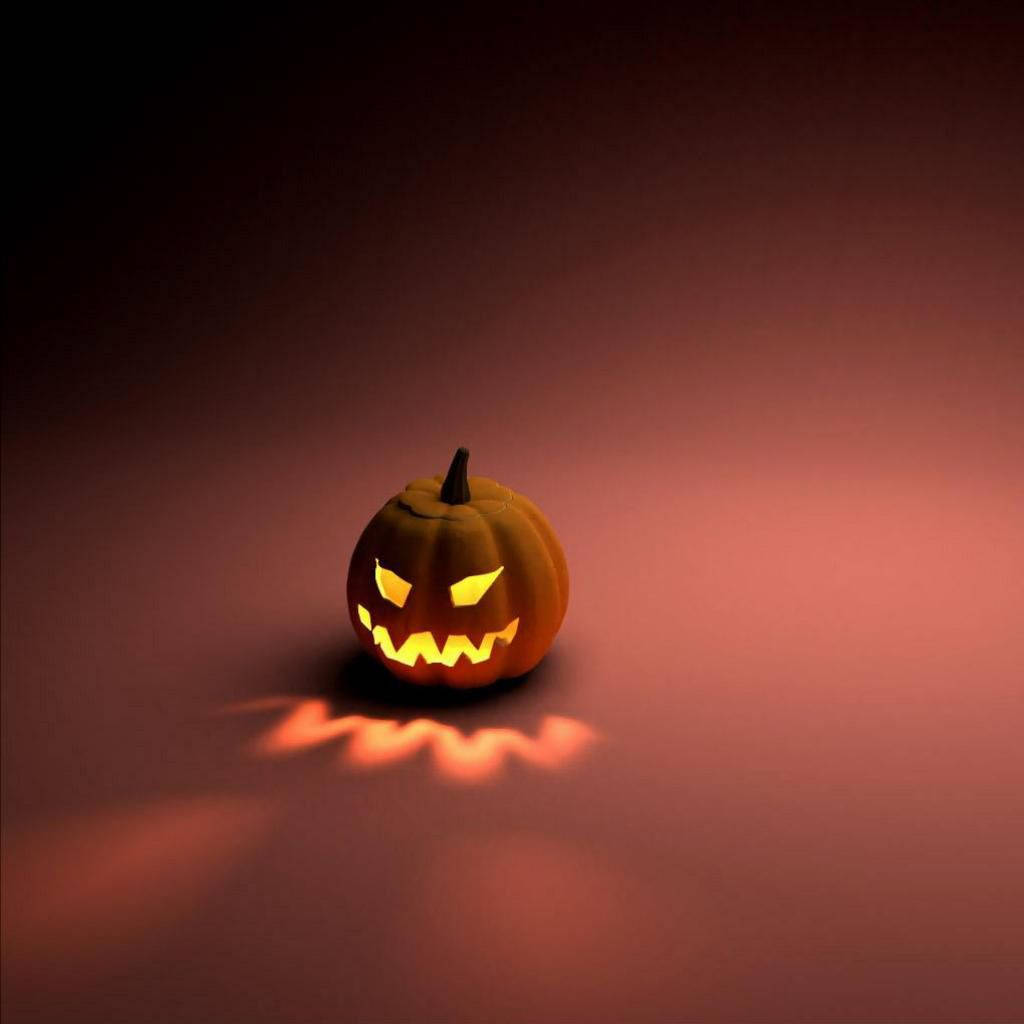 Halloween iPad 桌布 壁紙 — 一個發光的傑克南瓜燈，帶著兇險的笑容，在深色漸變背景上投射出詭異的橙色光和陰影。