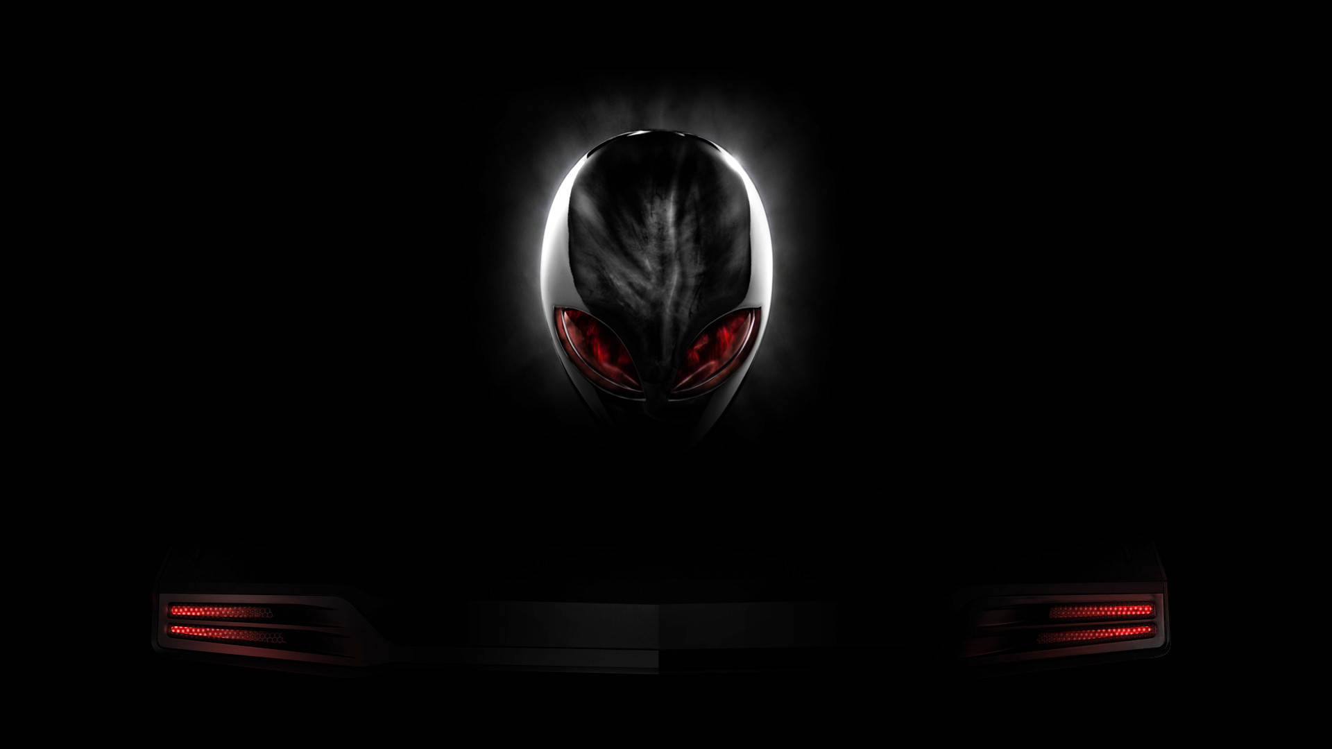 alienware logo 桌布 壁紙 — 一個發光的外星人頭顱，帶有紅色眼睛，從黑暗中浮現，位於一部帶有紅色LED燈的纖薄筆記型電腦上方。
