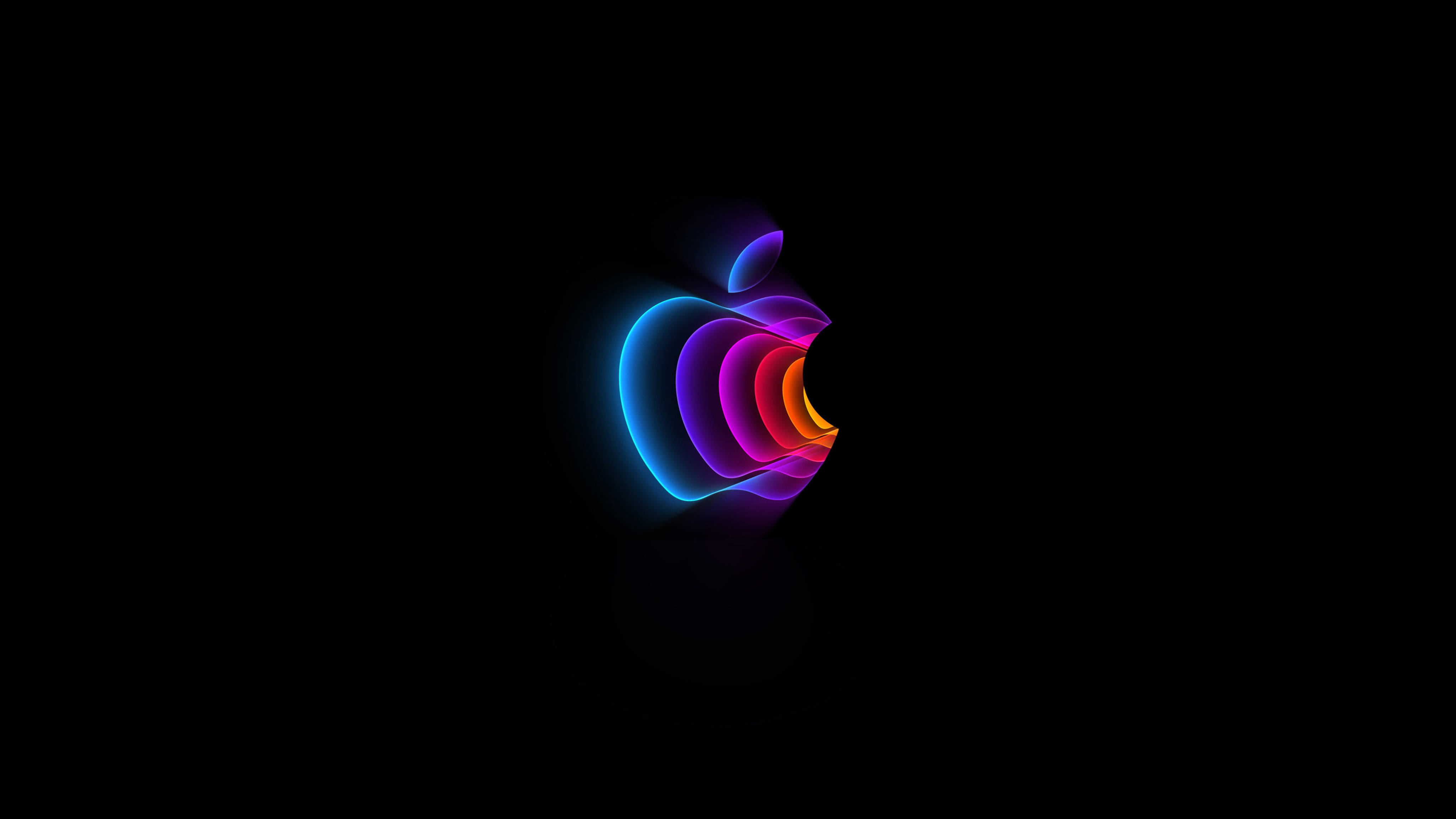 Apple 4K Ultra HD 桌布 壁紙 — 一個發光的彩色Apple標誌在純黑色背景上閃爍著霓虹藍、紫和橙色的色調。