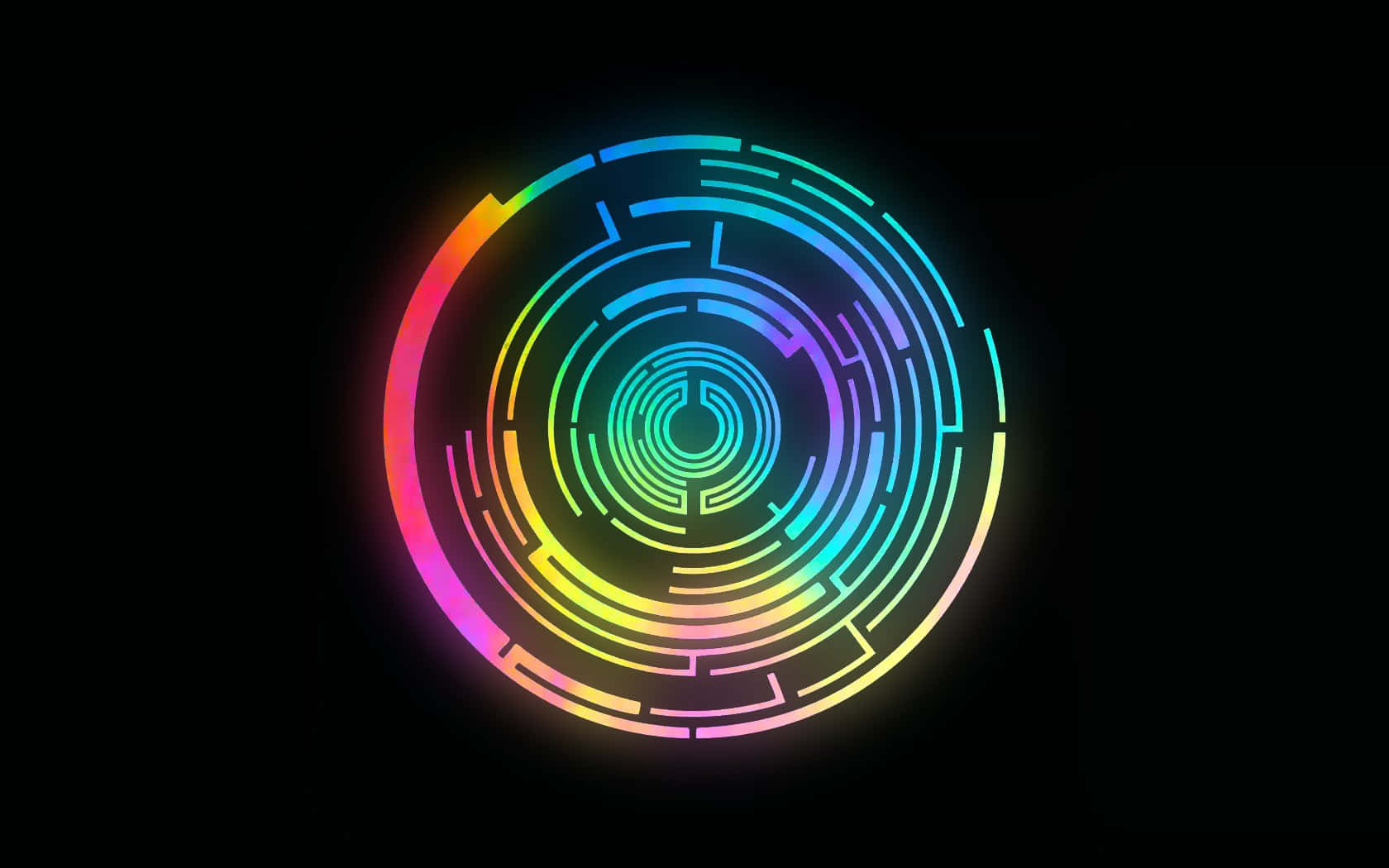 Circle 桌布 壁紙 — 一個發光的彩虹色圓形迷宮圖案在黑色背景上散發著霓虹燈效果。